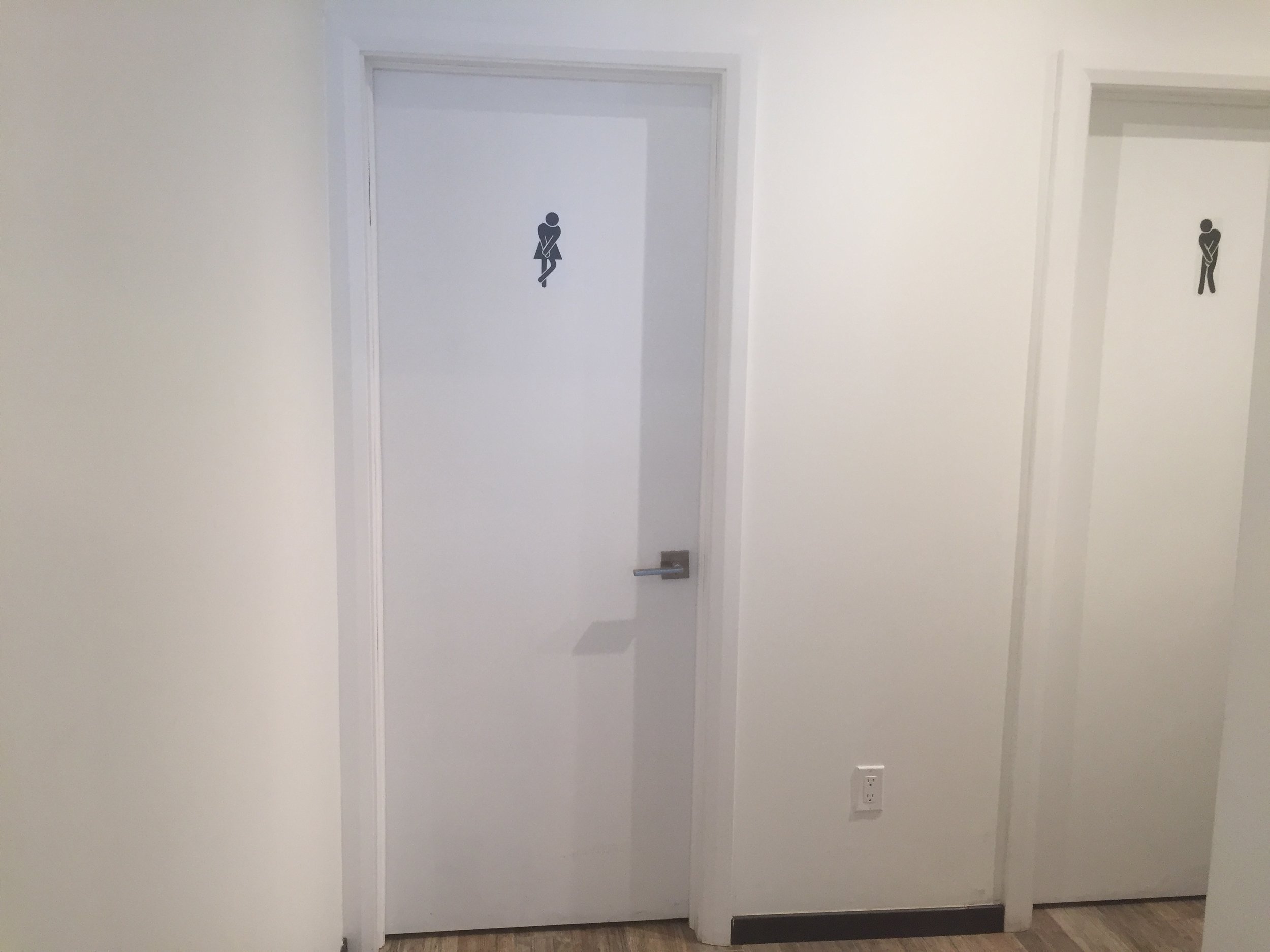 Picture of exterior of washroom door at Oliva