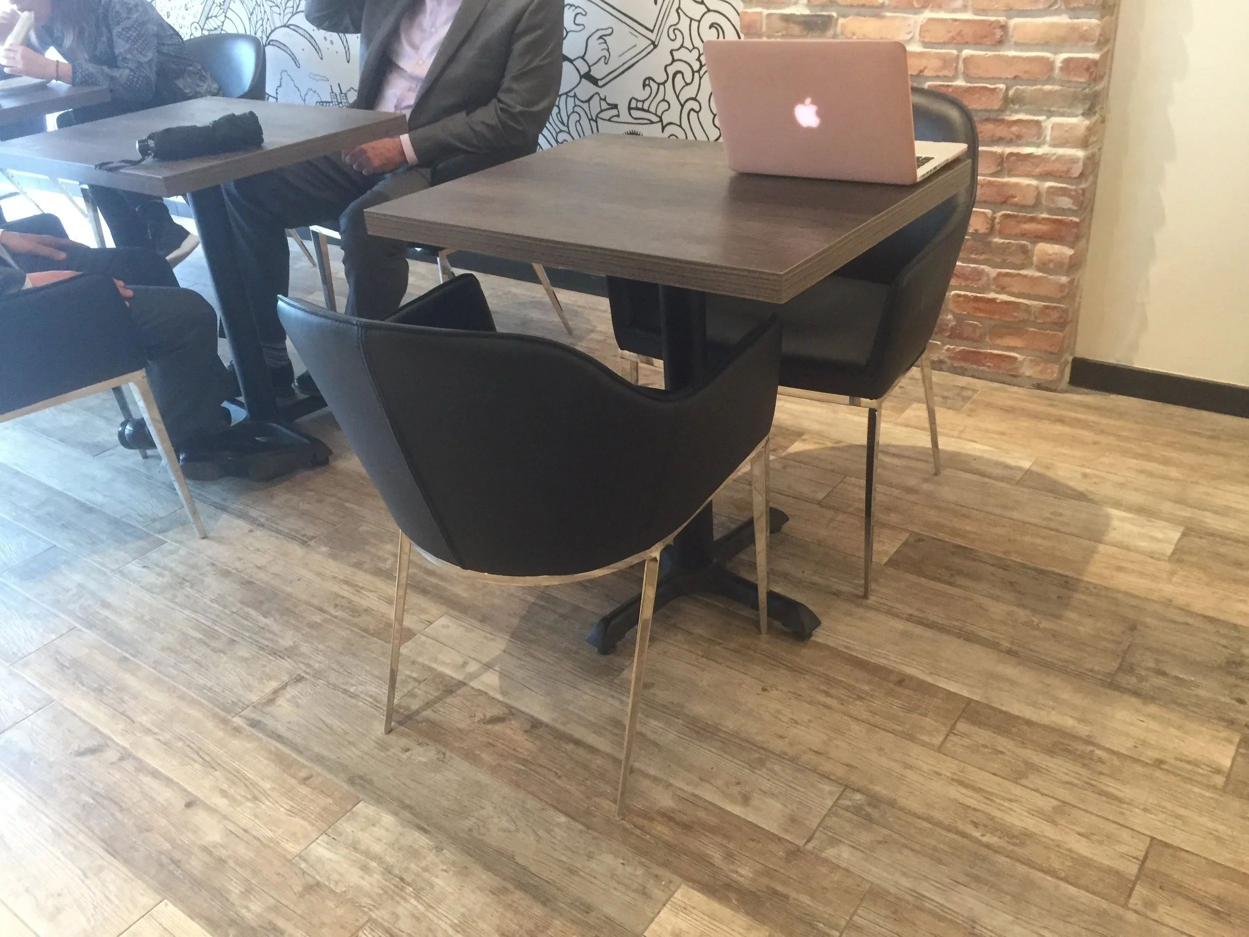 Picture of standard height table with removable chairs at Oliva