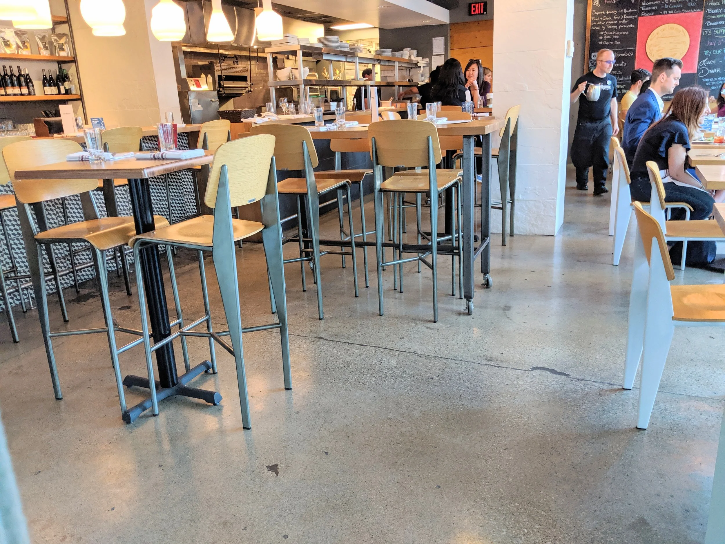 Picture of bar height and standard height tables at Hawthorne