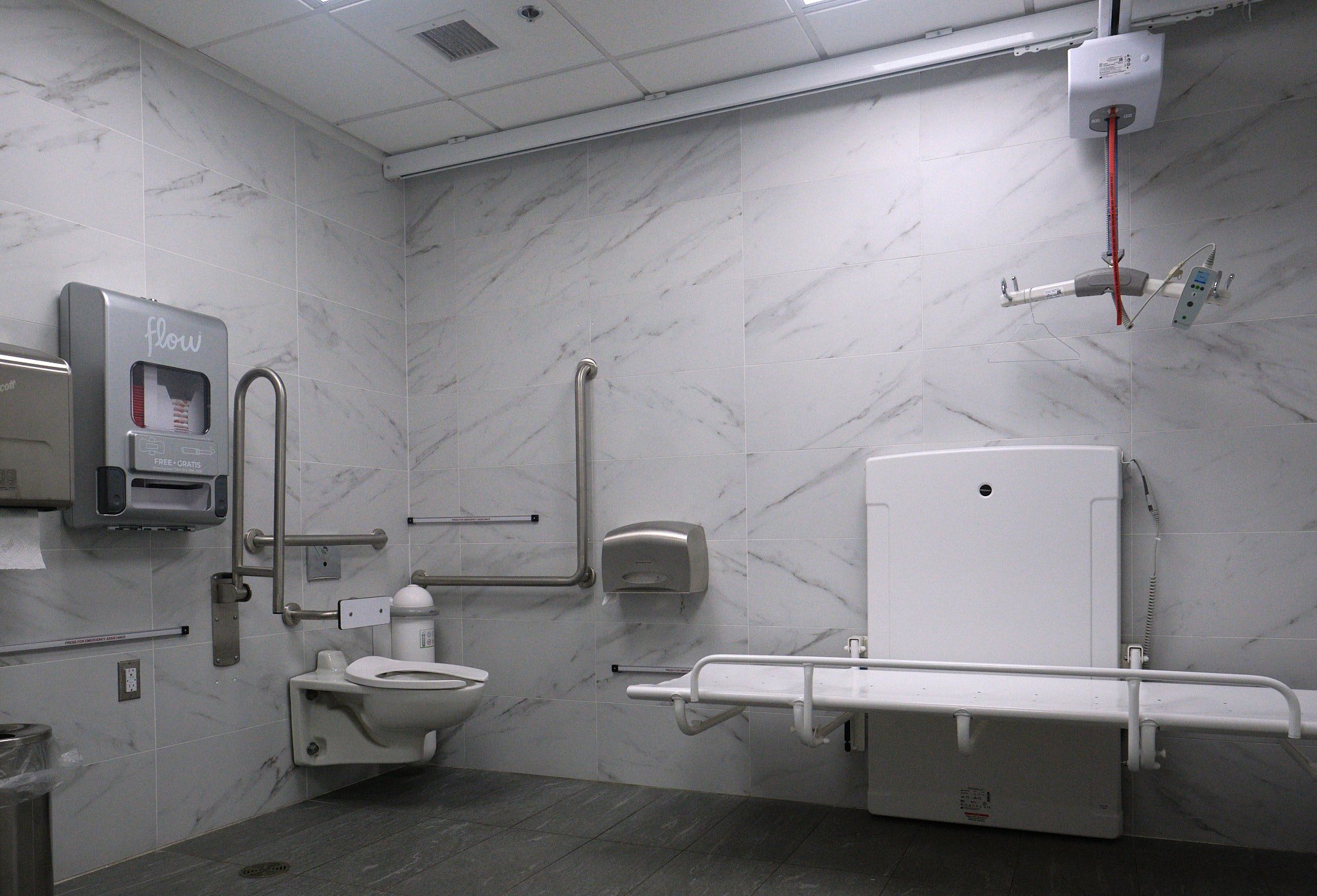 inside view of the washroom with automatic features and large change table