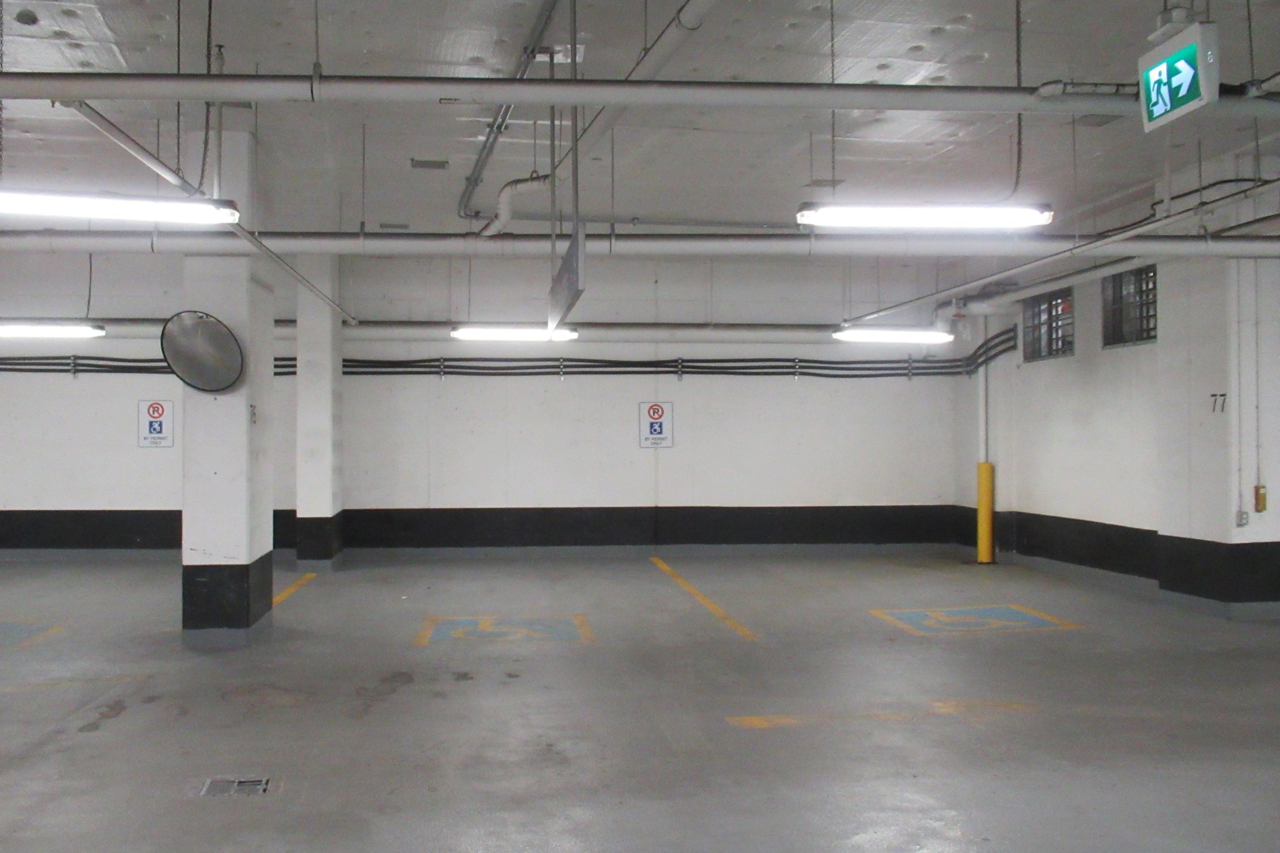 Wheelchair accessible parking spot in underground parking lot