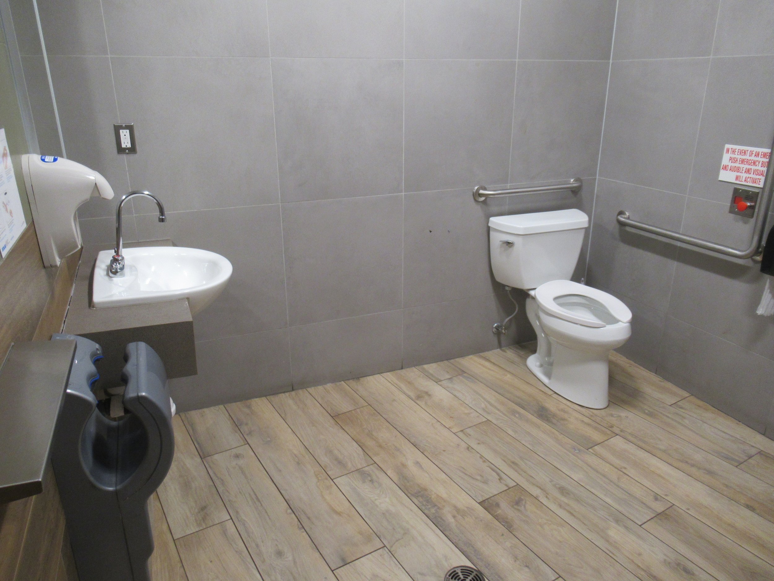 Large single stall washroom with automatic features