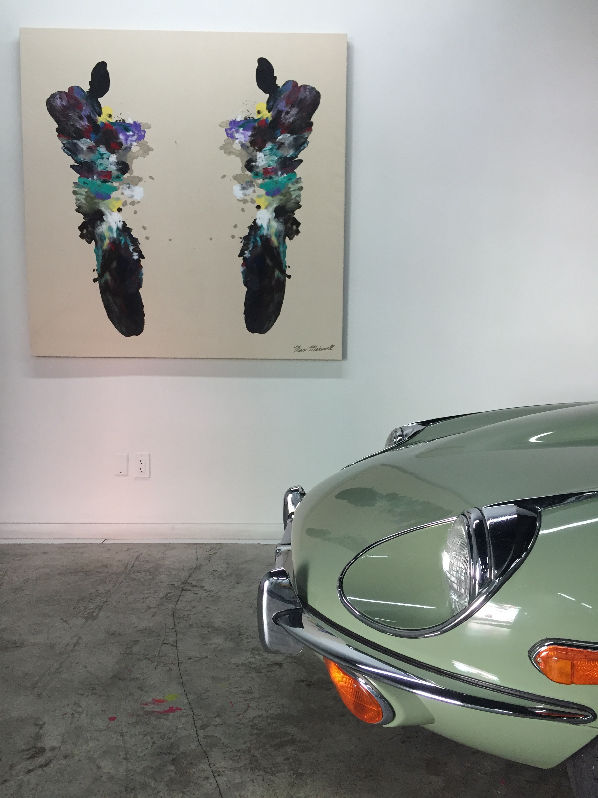 This Jaguar, compliments the raw canvas and simplistic design of Max's work. Max's Art showcased among classic collectable automobiles in special venues like Lou La Vie, an exclusive exotic car members club in Miami, FL. 