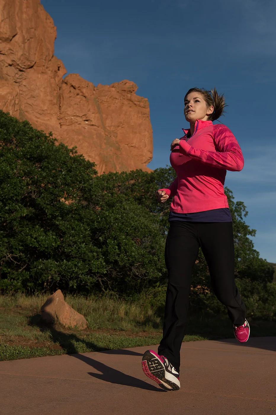 A female athlete run in the Garden of the Gods near Colorado Springs, CO