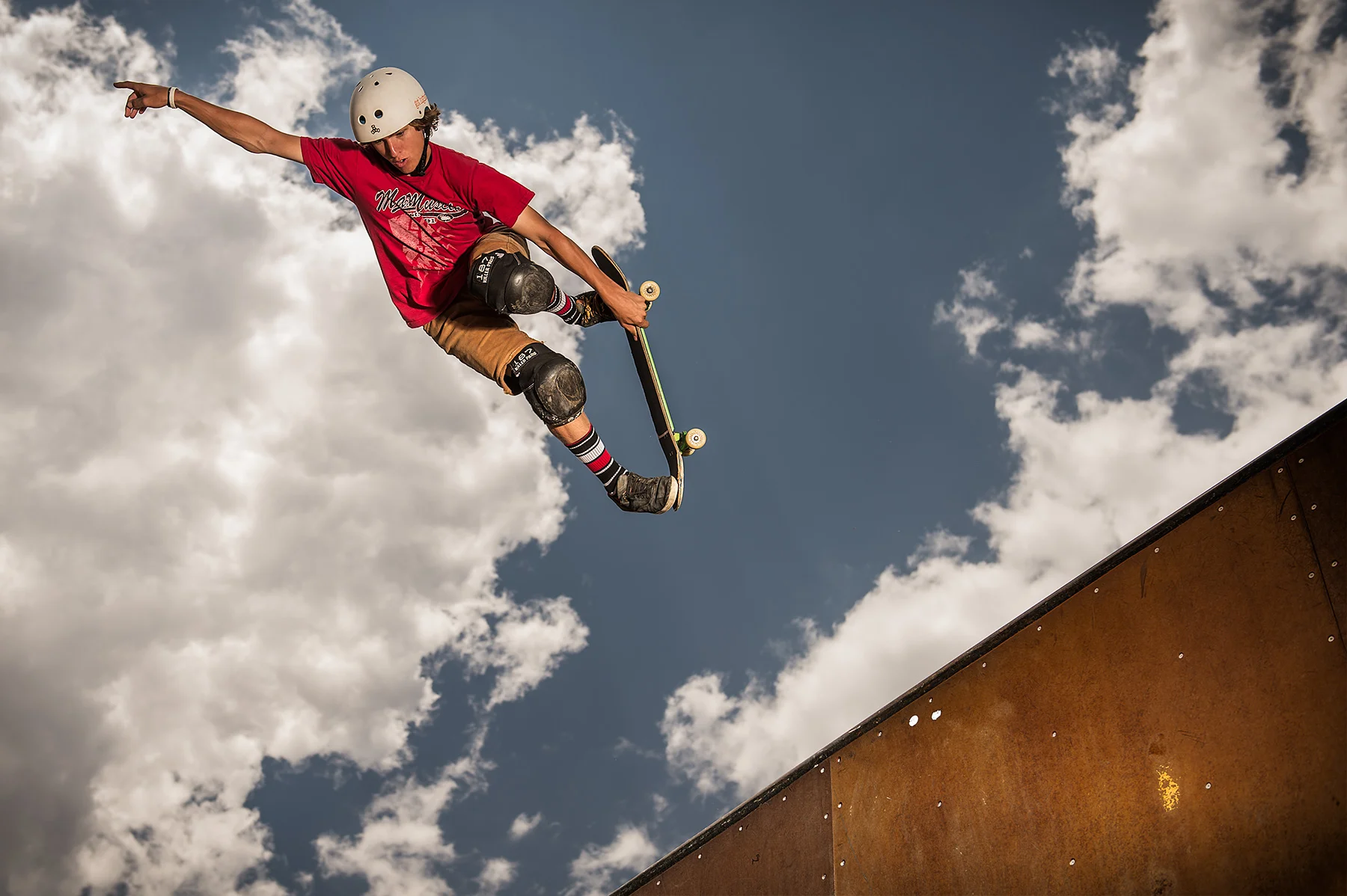 A skateboarder flies high into the sky in Colorado Springs, CO