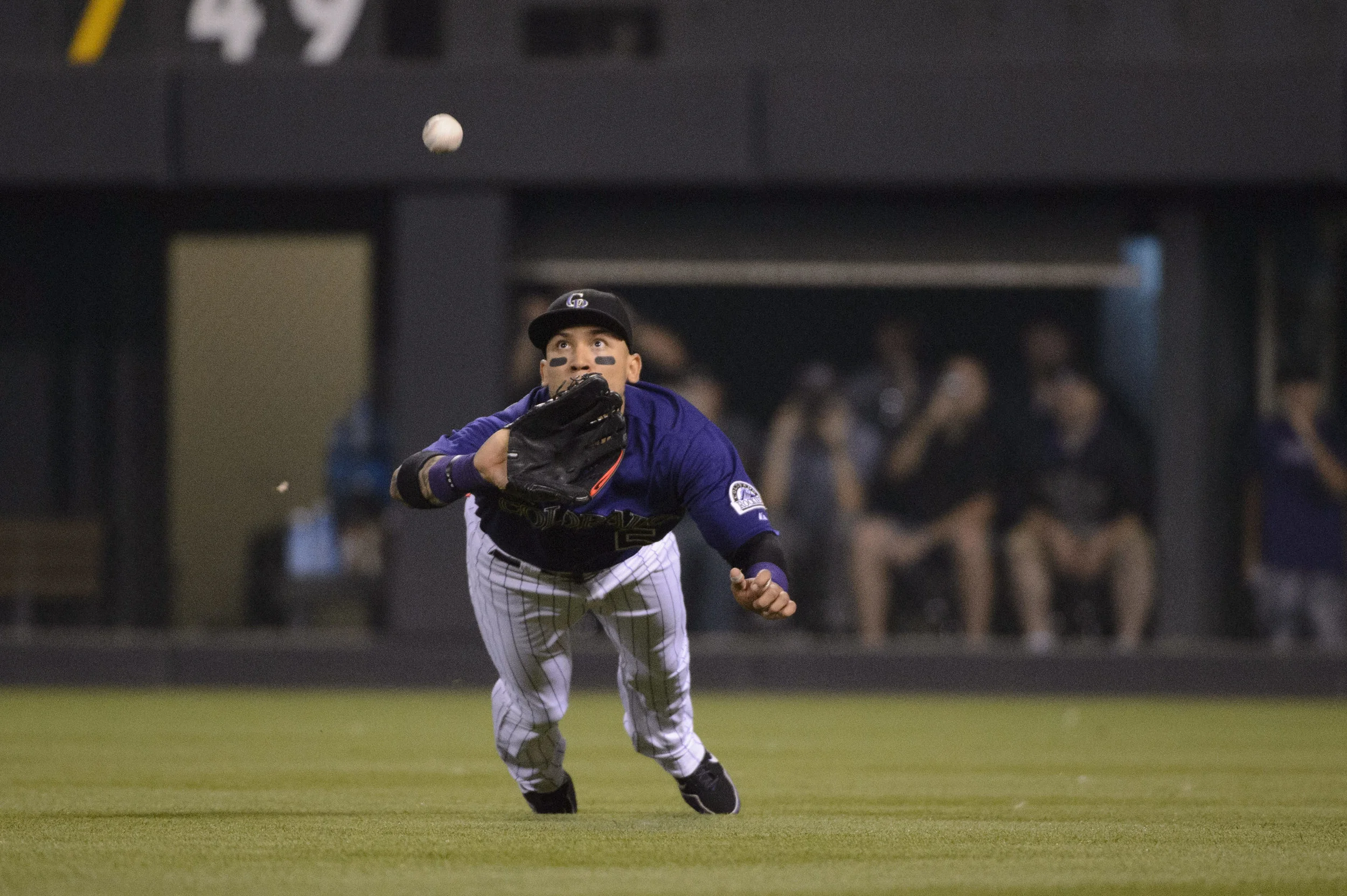Rockies' outfielder Carlos Gonzalez makes a diving catch