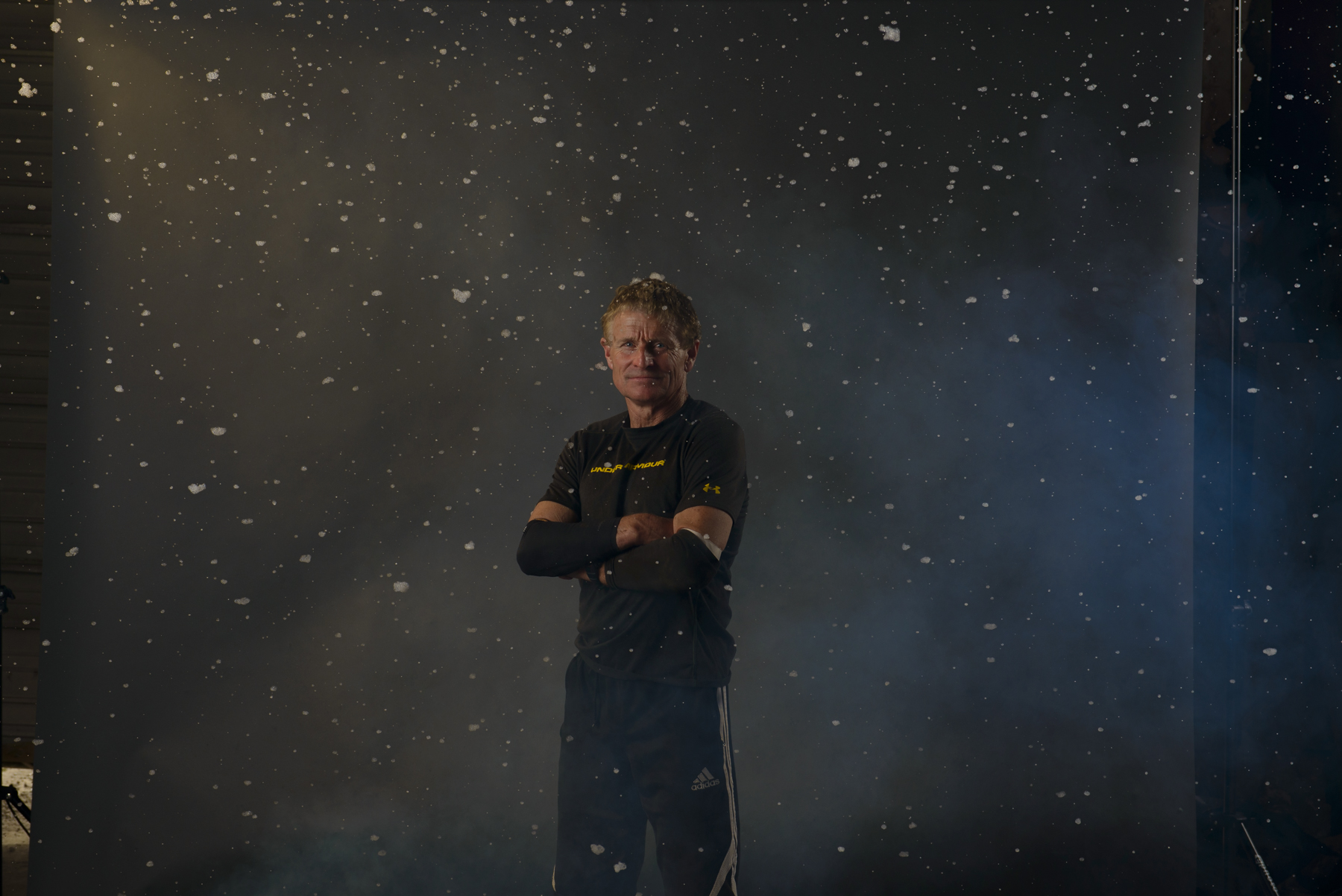 Lighting test image straight out of camera (SOC). Beauty dish with cto gel, parabolic umbrella, smoke machine and snow machine camera left and softlighter II umbrella camera right.