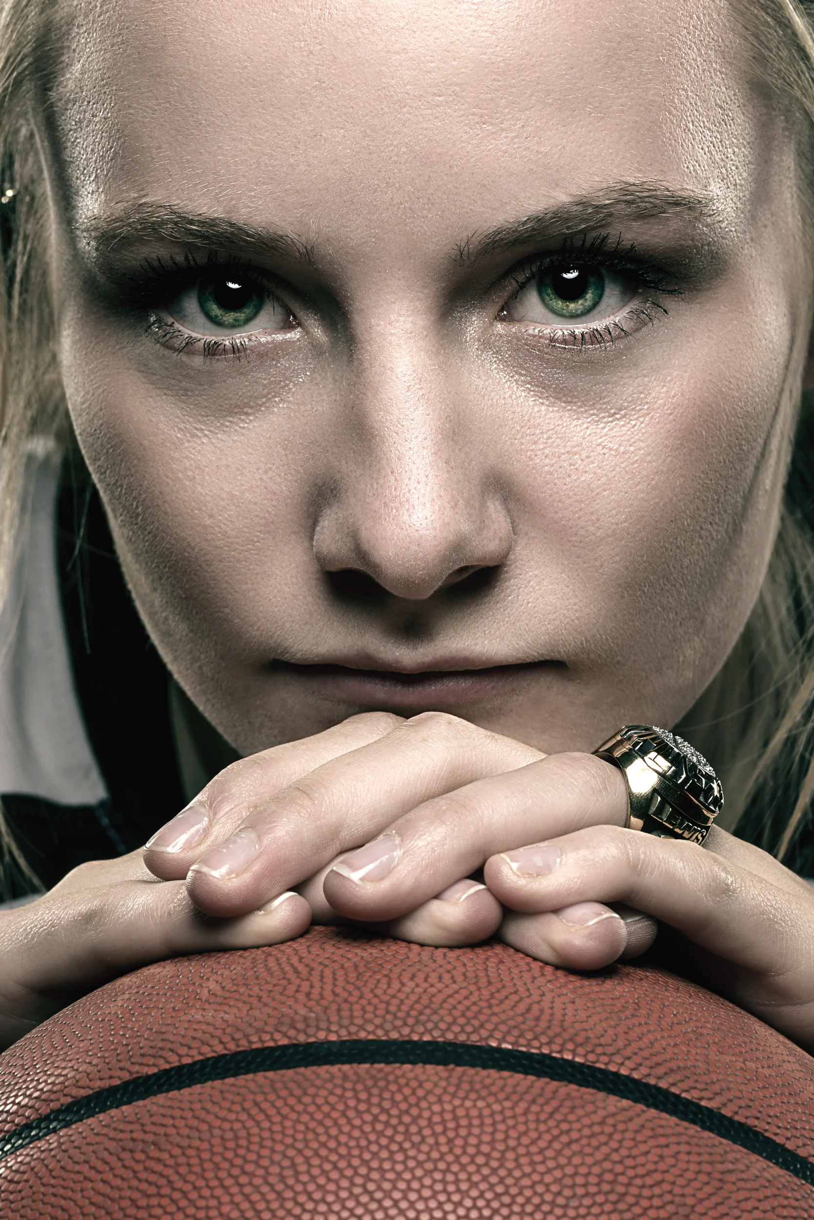 Female basketball player portrait with championship ring