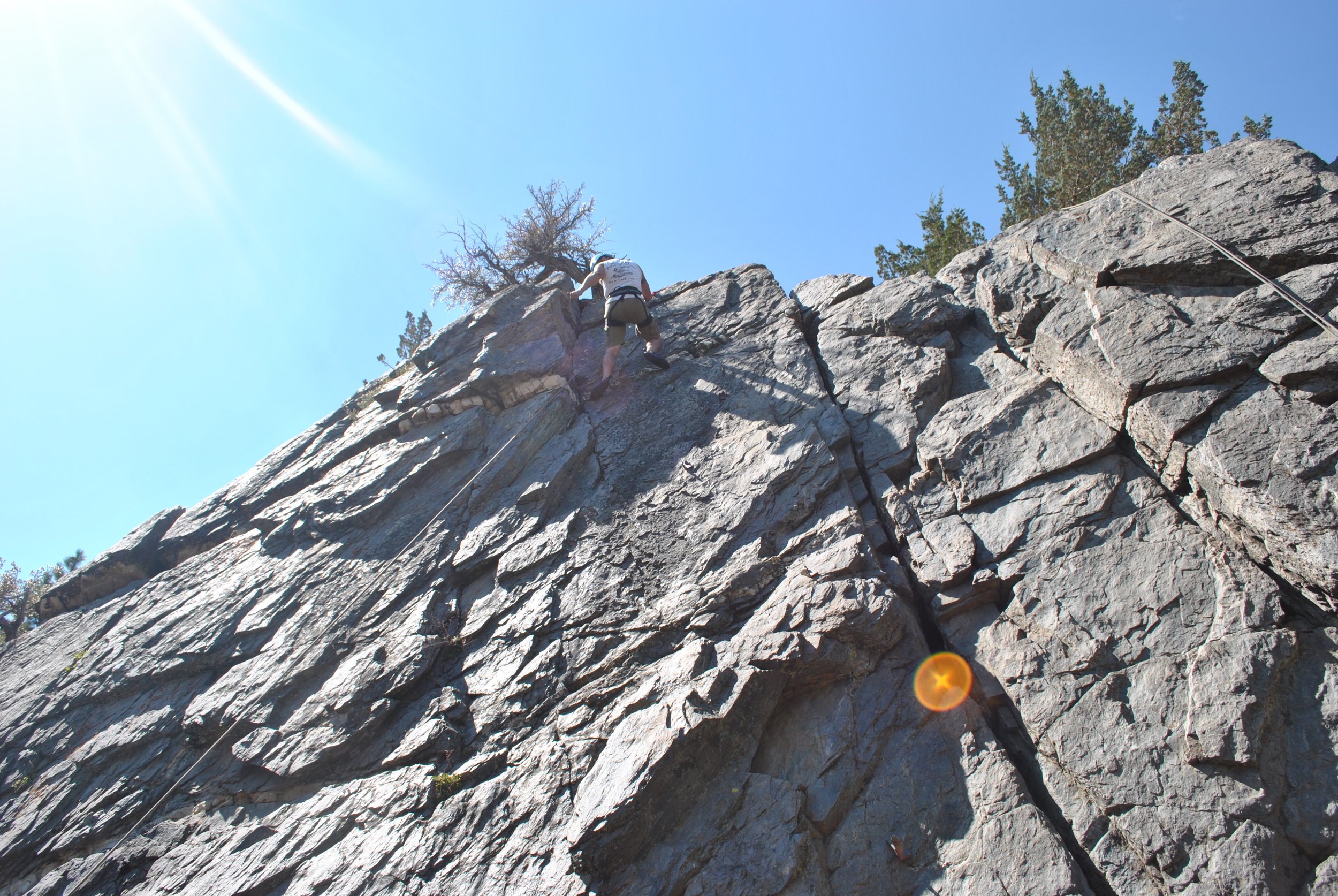 Climbing at the Marine Mountain Warfare Training center. Paul Kennedy and his Marine Corps expert climbing instructors took some time off to hang out and climb with us. Heres me topping out on this climb. 