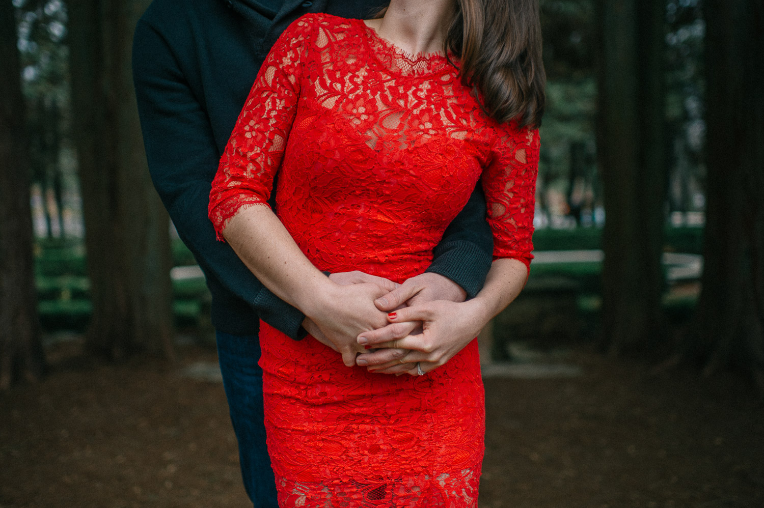 Woman in red dress getting engaged at Hidden Valley Farm
