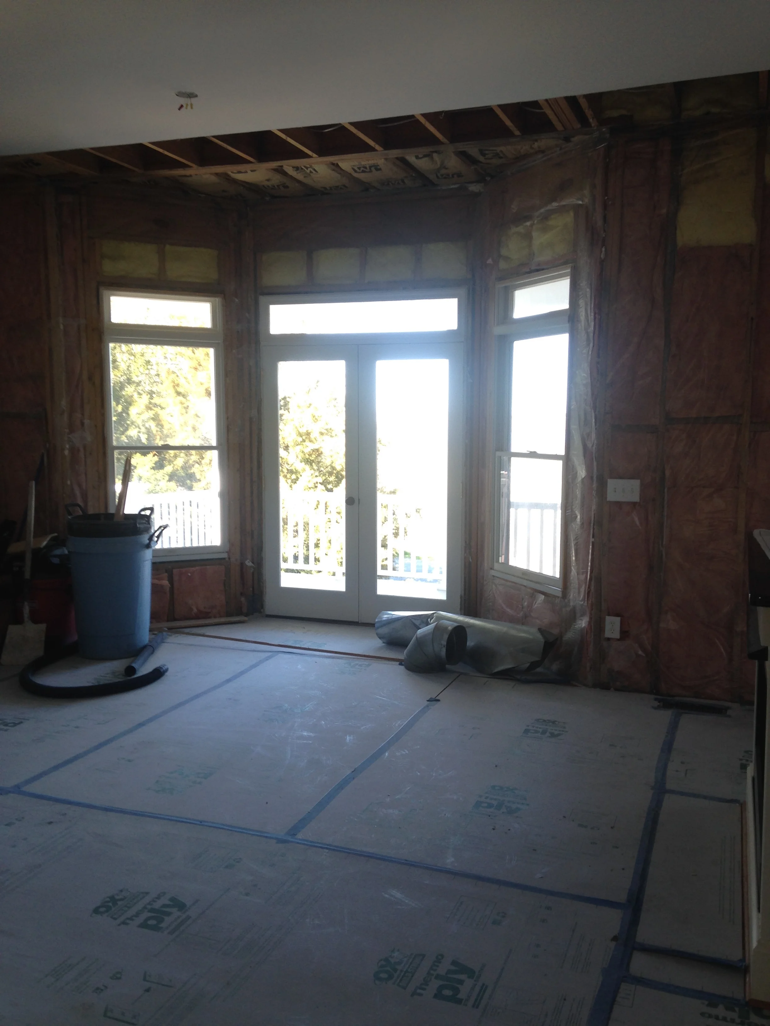  Two bay windows were replaced with full rooms that maximized the view. We used folding glass doors at the screened porch to bring the outside in.  
