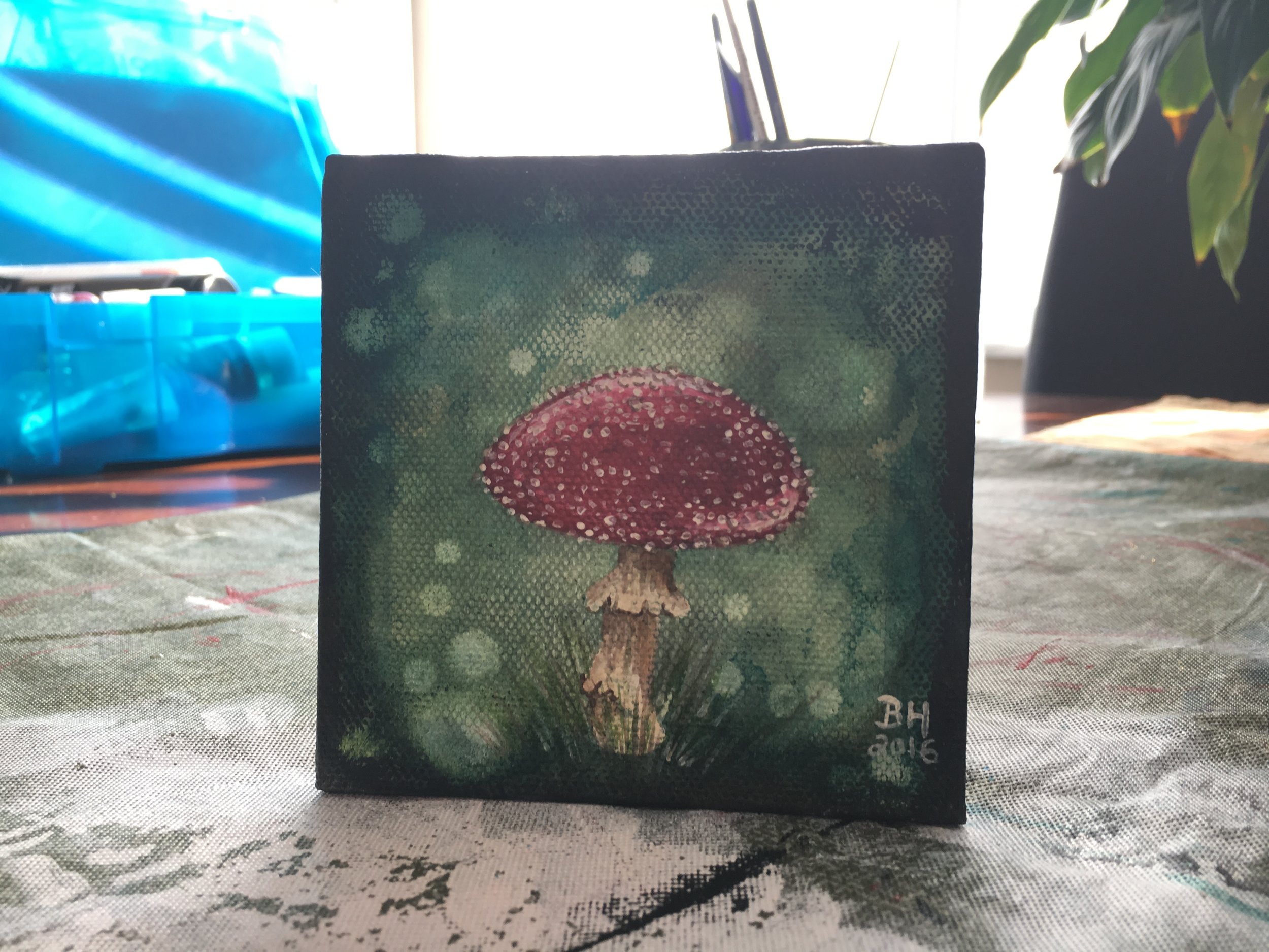 I recently replaced the stylized alligator I had painted on this mini canvas with a fun little mushroom, and I'm very happy I went back and reworked that painting that I didn't like instead of throwing the canvas in the garbage! (I throw away A LOT of failed attempts.)