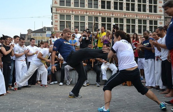 Mestre Sabiá playing with Professora Pimentinha at an outdoor roda in Belgium he organized. As you can see from all the onlookers behind the players, Capoeira always draws a crowd. To see more click here. 