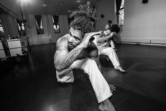 Students train individual movements in formation (such as the Negativa seen above) which are assembled in sequences, and all of which require a tremendous amount of strength, training, agility and flexibility to get right. (Photo by Ace Murray / Brooklyn Juice Photography .)