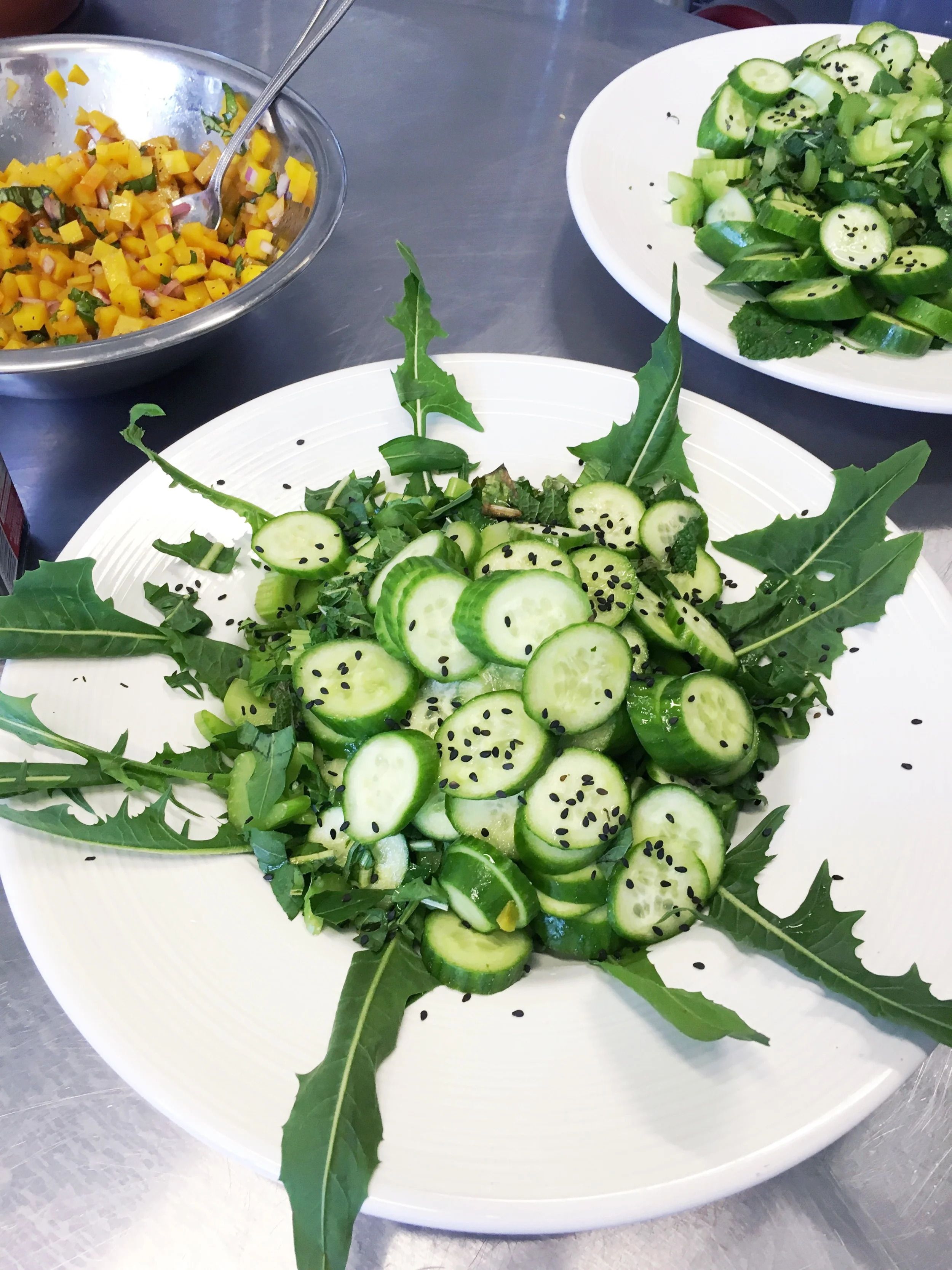Salad with Persian cucumber and dandelion leaves.