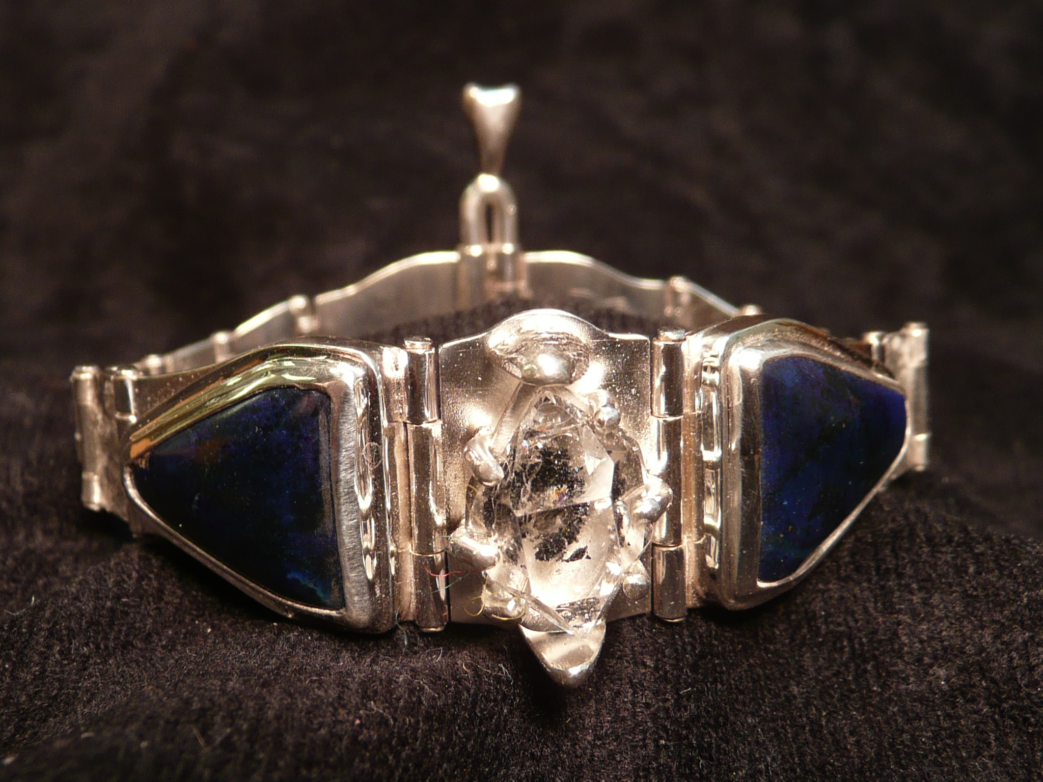 Quartz from Herkimer, New York and azurite cabochons from the Morenci Mine in Arizona. Set in a sterling silver articulated bracelet. Sold.