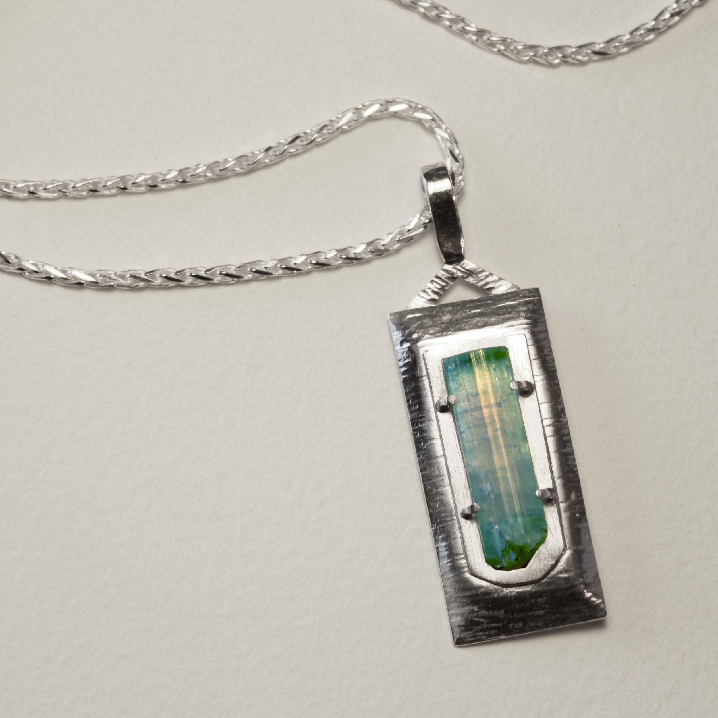 Tourmaline crystal from Afghanistan. Set in sterling silver. Sold.