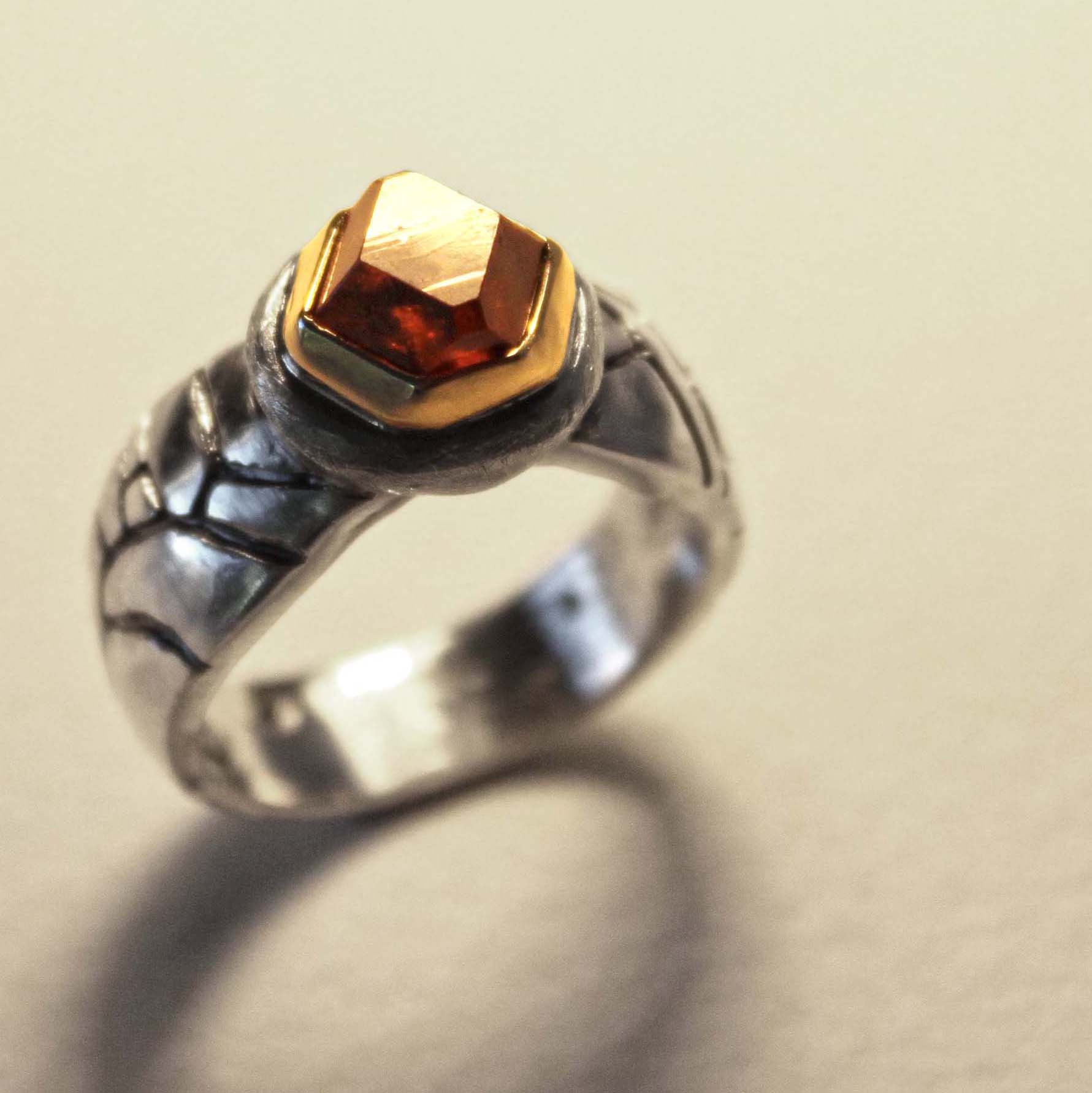 Garnet crystal from Vesper Mountain, Washington. Set in casted sterling silver with 14k gold bezel.