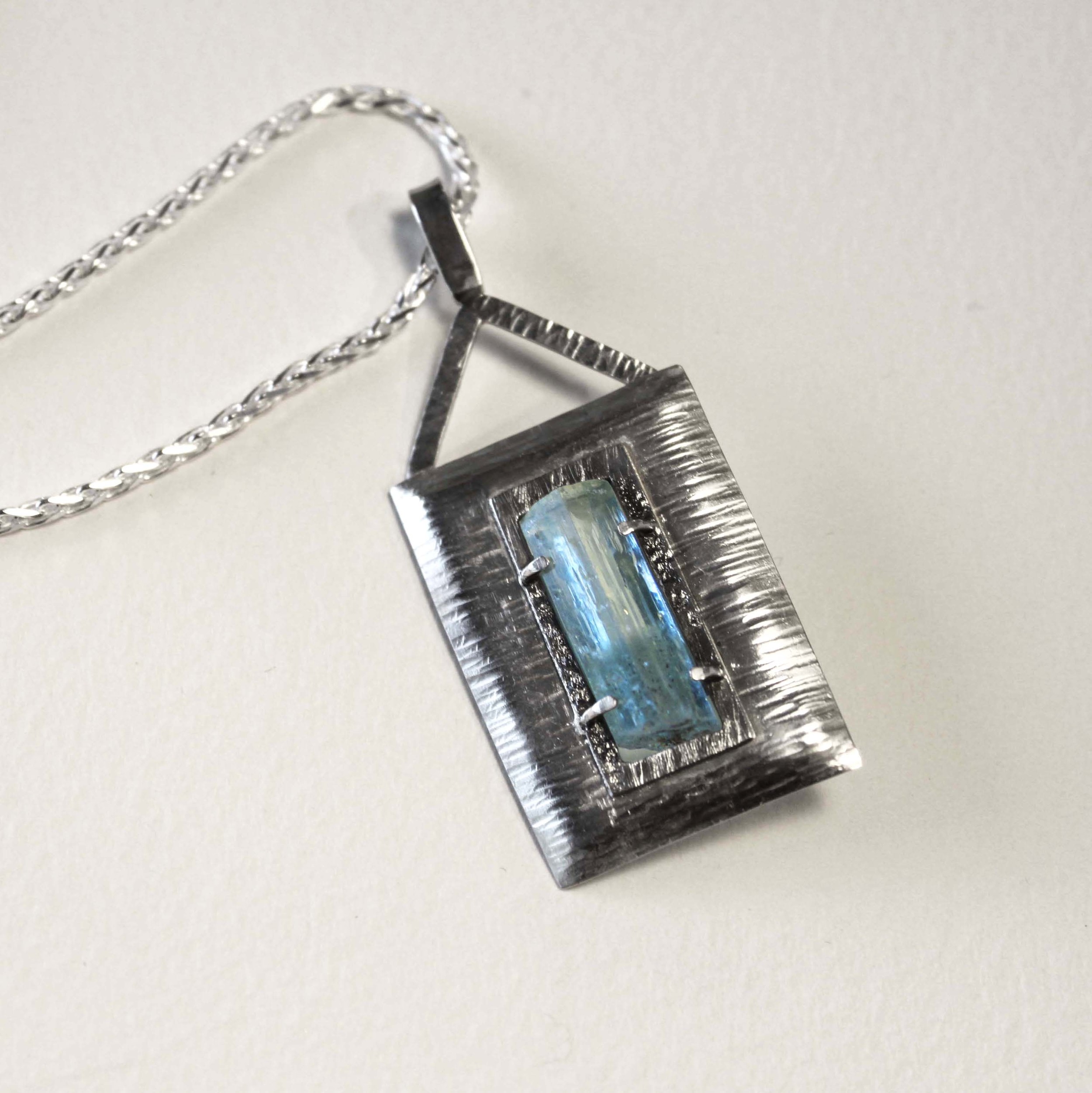 Aquamarine crystal from the Erongo Mountains, Namibia. Set in textured sterling silver. Sold.