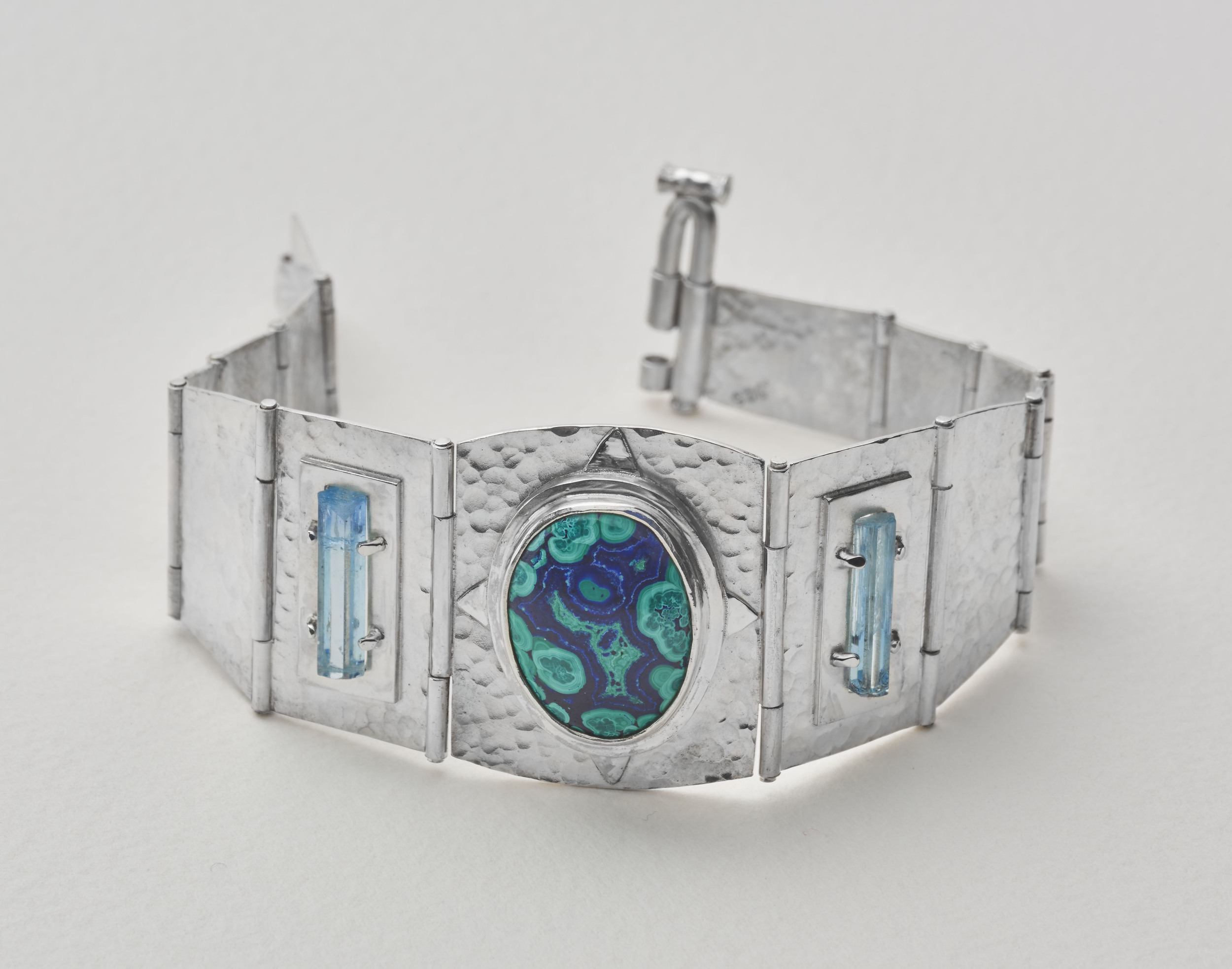 Azurite/malachite from the Morenci mine with aquamarine from Vietnam. Set in a sterling silver articulated bracelet.