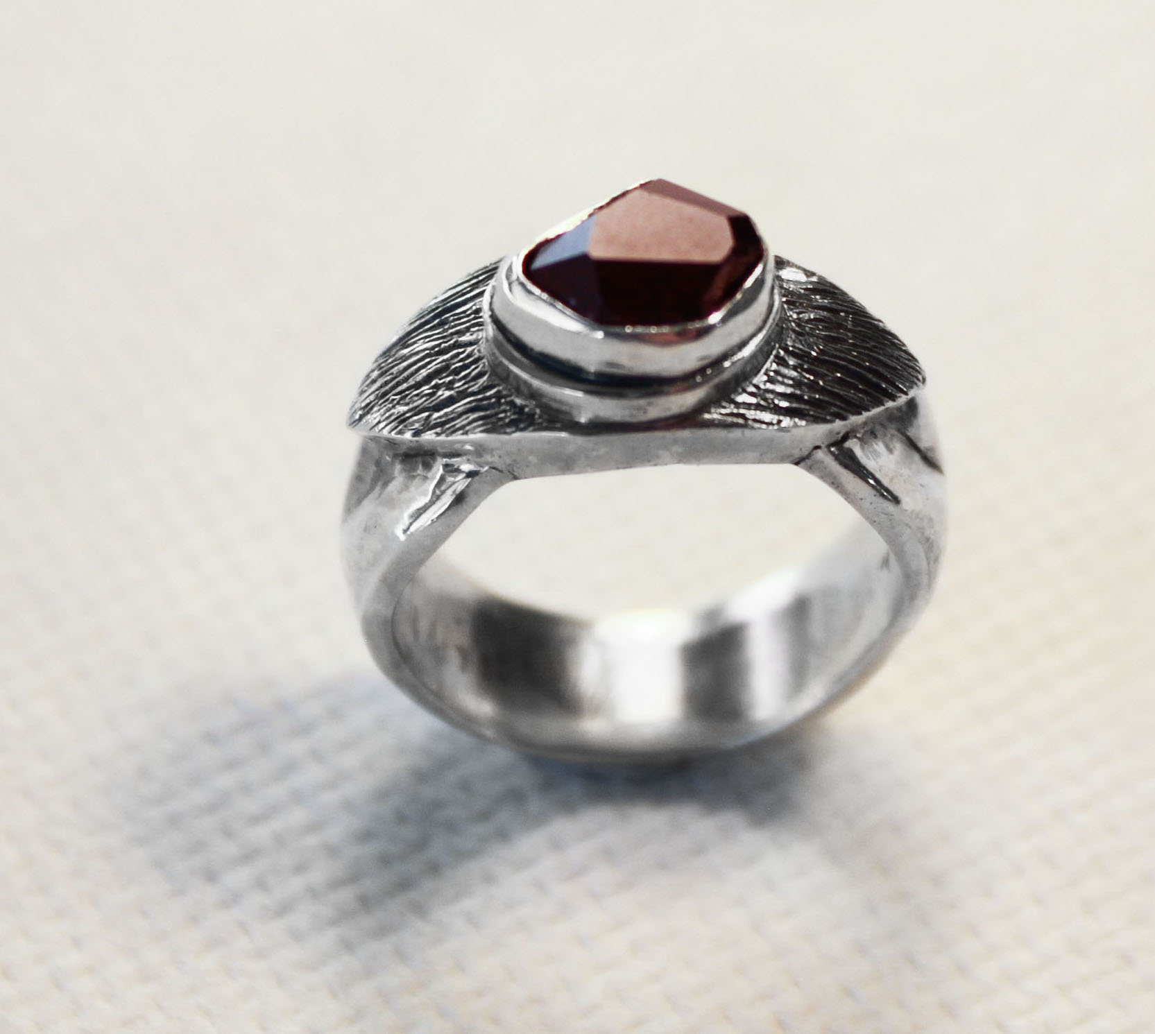 Garnet from Garnet Hill, Ely, Nevada set in a casted sterling silver ring. Available at Echo of the Dreamer, Sedona, Arizona.