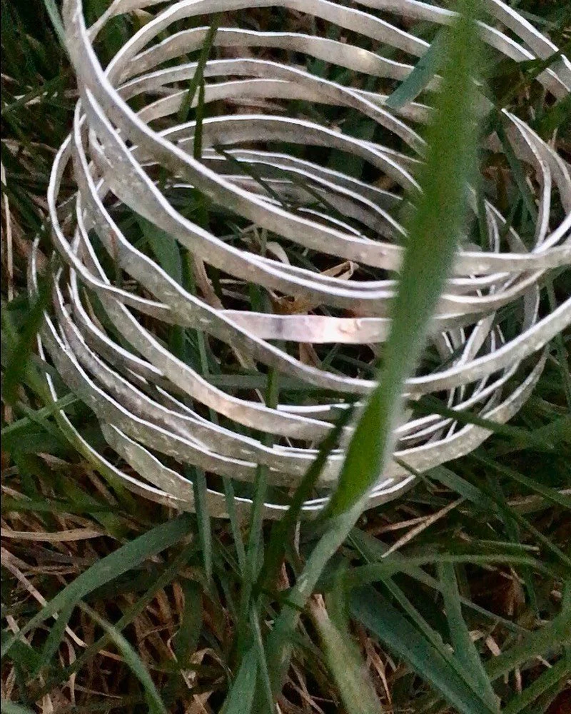 hammered wrap bracelet in silver&hellip;organic, fluid, sculptural, and comfortable.  made with recycled silver and outdoors where i am mostly in deep reverence for all that is green &amp; wild. 
#rewilding, #handmade, #organic, #bracelets , #recycle