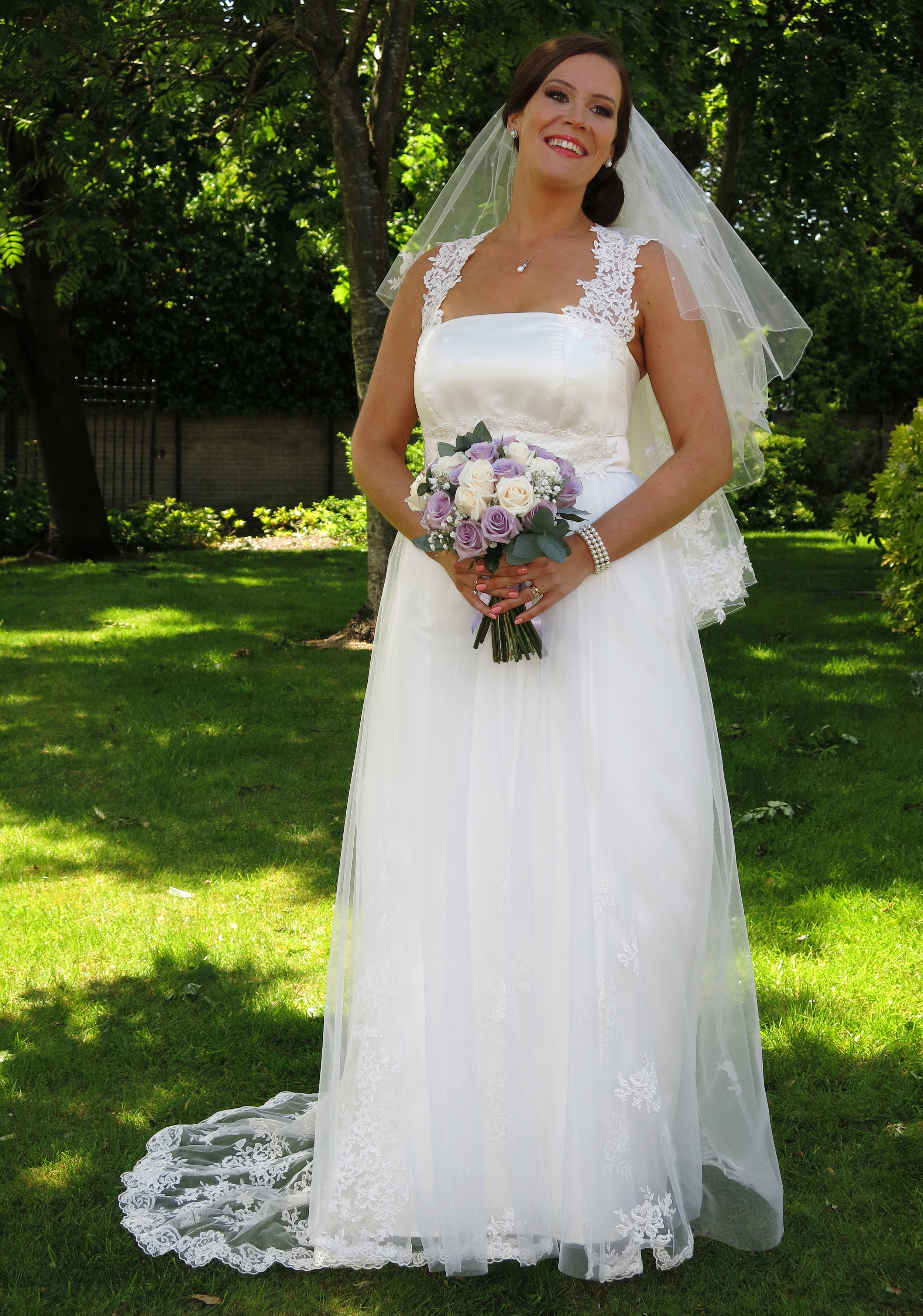 Charlotte : Duchess satin overlaid with silk tulle, corded lace straps, godets and train.