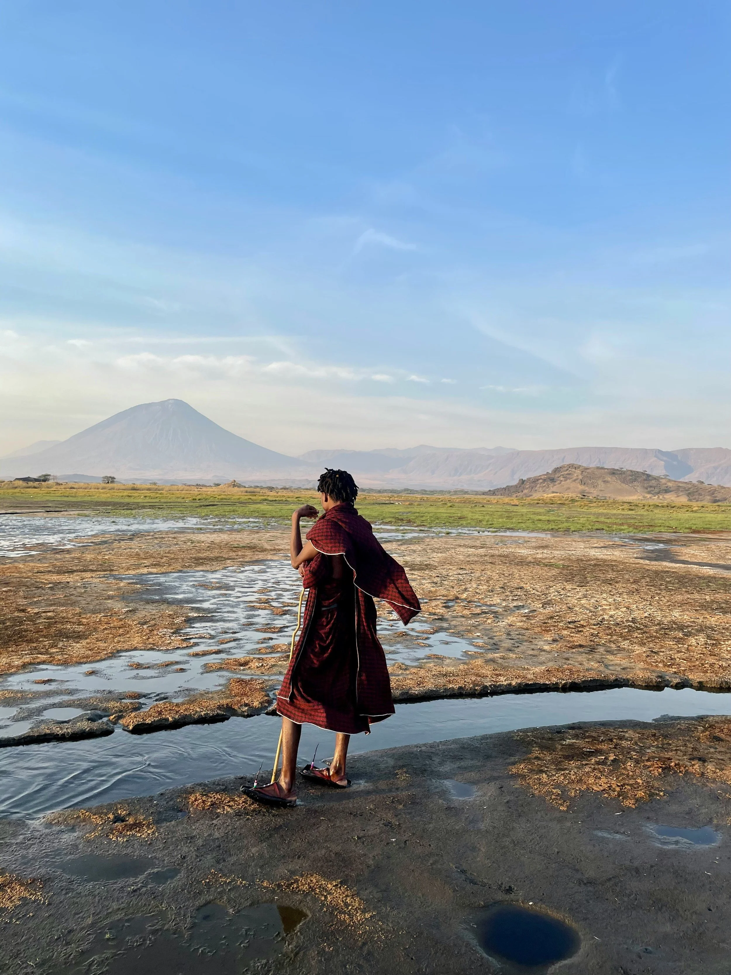 A tribesman looking over the sunrise at lake Natron