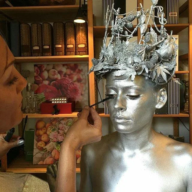Dawn Stone completes the look on the silver body-painted model wearing only her one-of-a-kind Snow Queen Crown - part of the Dawn Stone Couture Collection. 