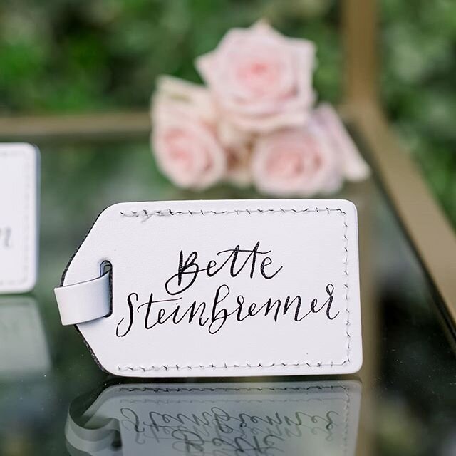 Travelbug anyone?! How cute are these hand lettered escort card luggage tags?