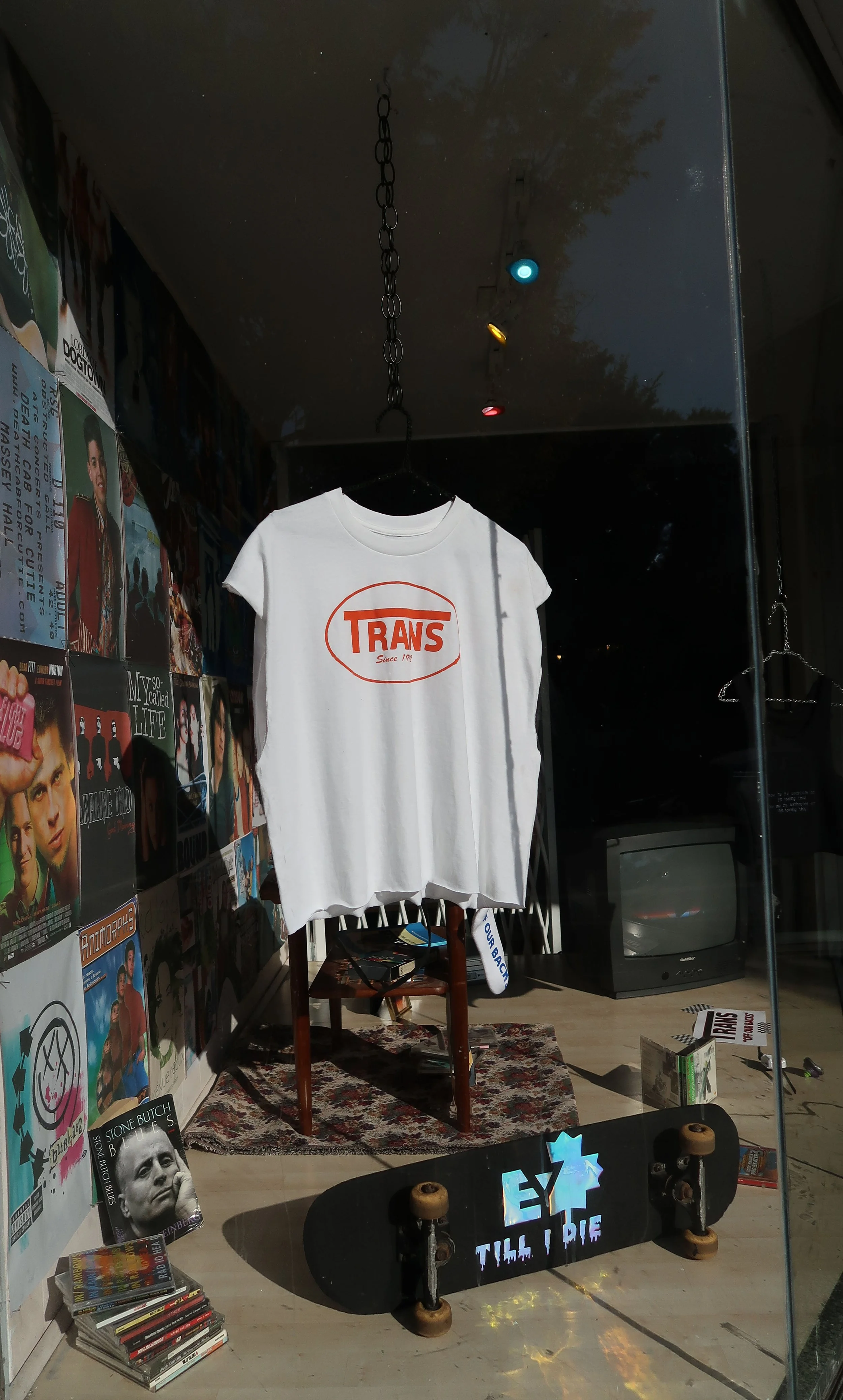  Screenprint on Cotton T-Shirt, Vinyl and Acrylic paint on Skateboard, Wheatpasted Xerox print wall, Various Found Objects.&nbsp; 