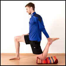 This is good form in stretching the psoas. Note how the trunk is vertical and in a neutral position, pushing through the pelvis. 