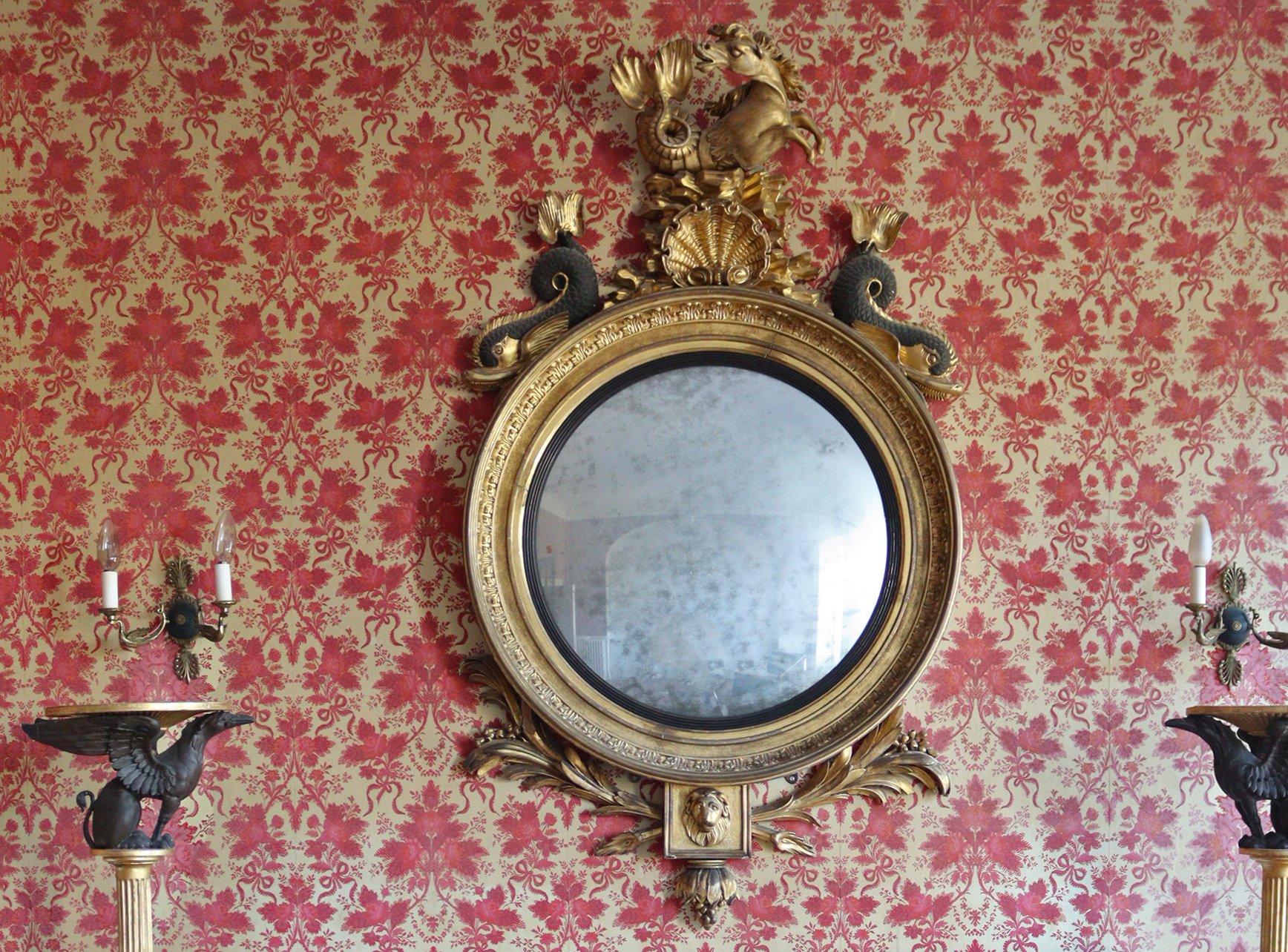 A REGENCY CONVEX WALL MIRROR