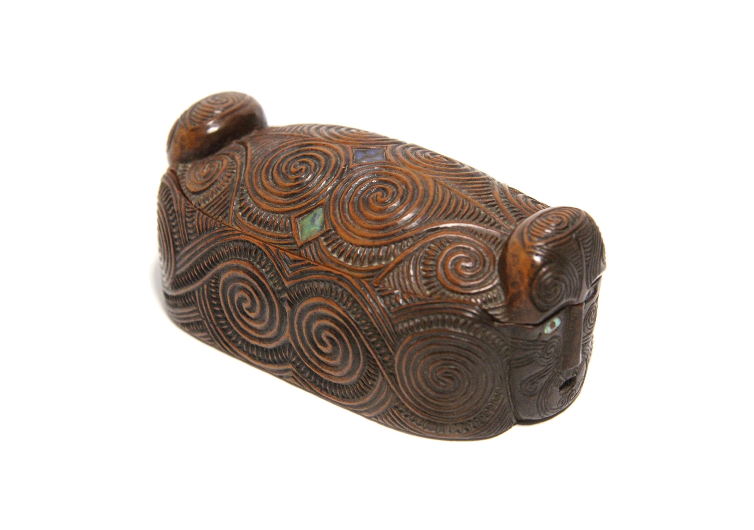 An antique Maori carved feather box