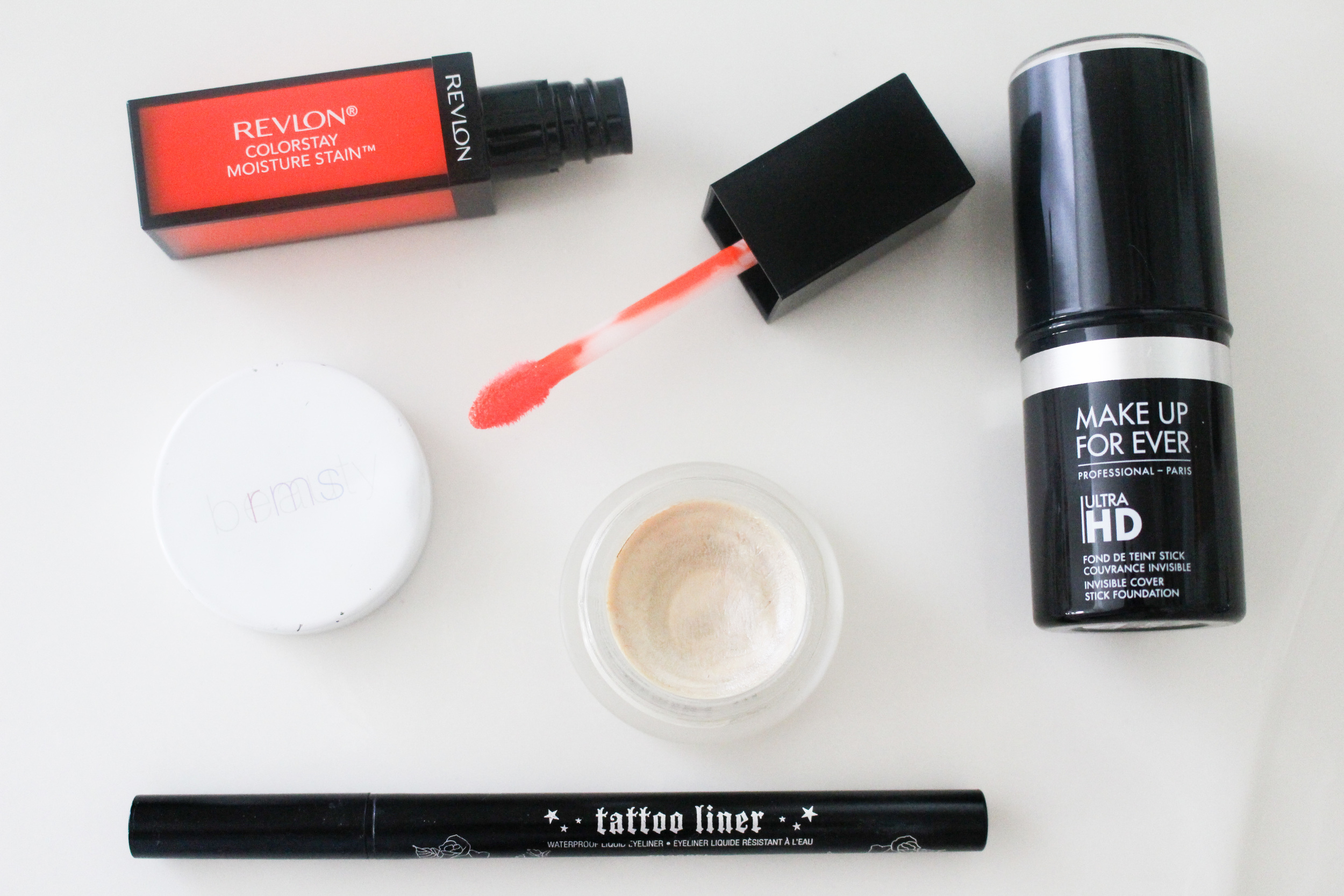 BRIGHT COMPLEXION, GRAPHIC LINER, AND AN ORANGE LIP