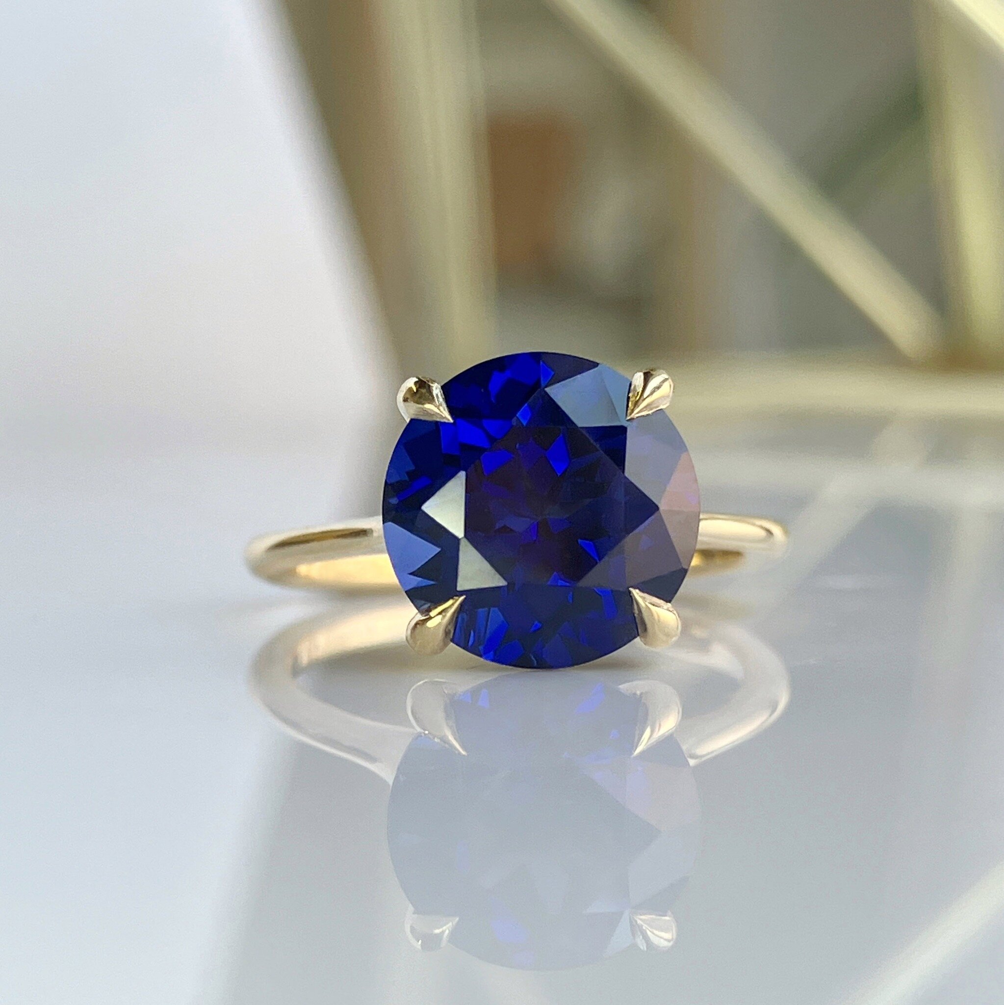 No filters needed, this sapphire is just really that beautiful!

The combination of 18k yellow gold and blue sapphire is just SO satisfying. The richness of the gold enhances the brilliance and depth of the sapphire.

Congratulations C &amp; G!

Cust