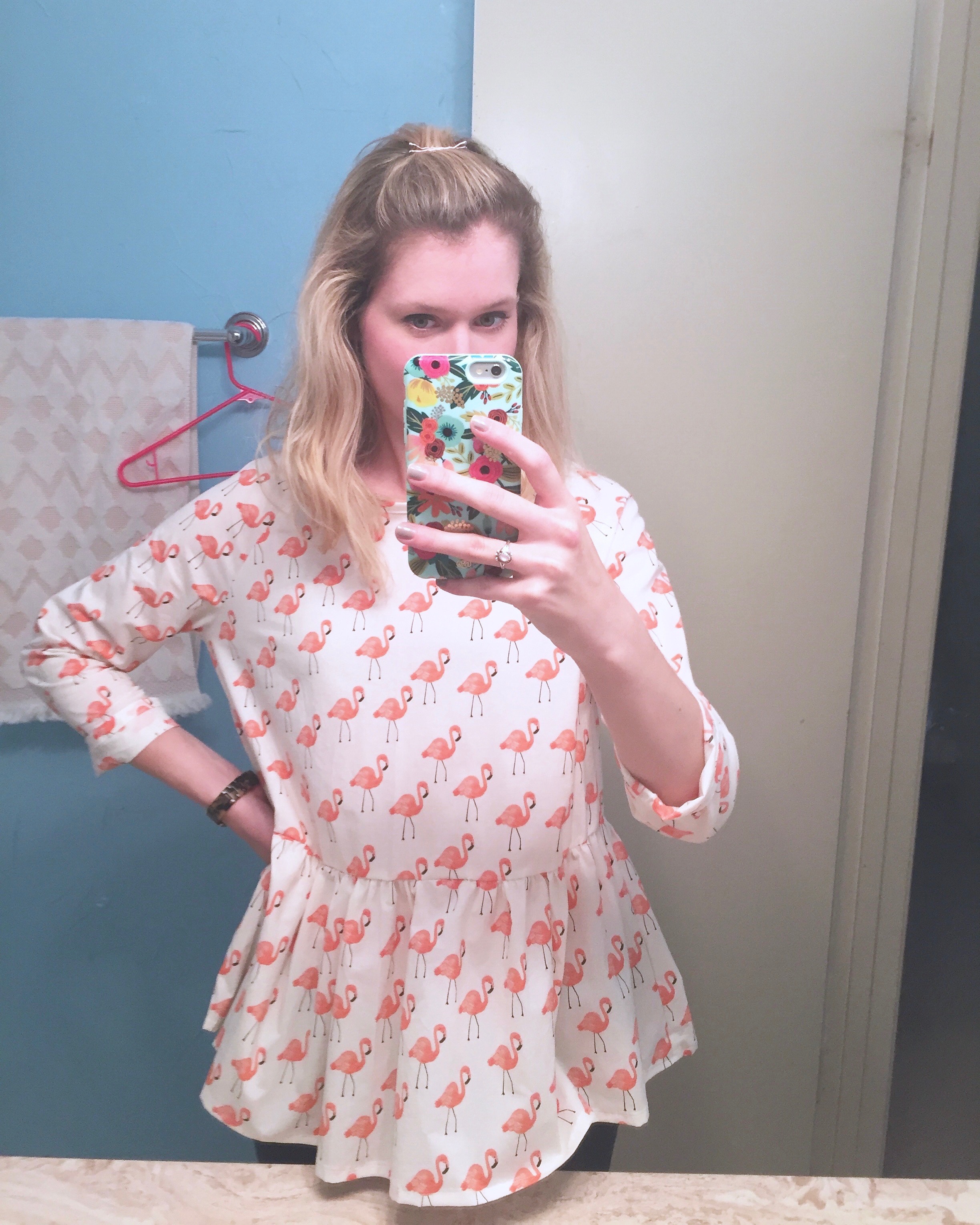 Photo of it on because I hate when people don't post photos of them wearing something!!! I need to know how it lays and stuff, people! 