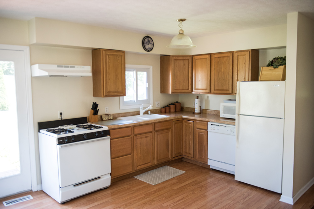  Main kitchen area with gas stove, refrigerator and dish washer. 