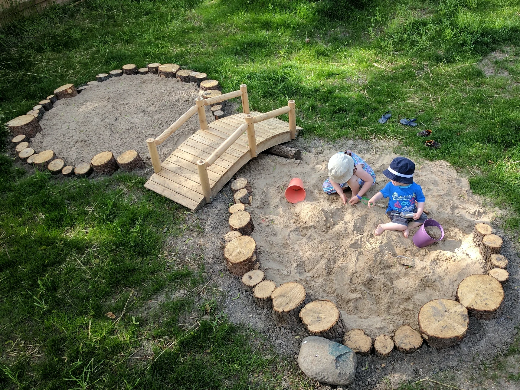 Breaking in the new sand area in the Nestling House yard.