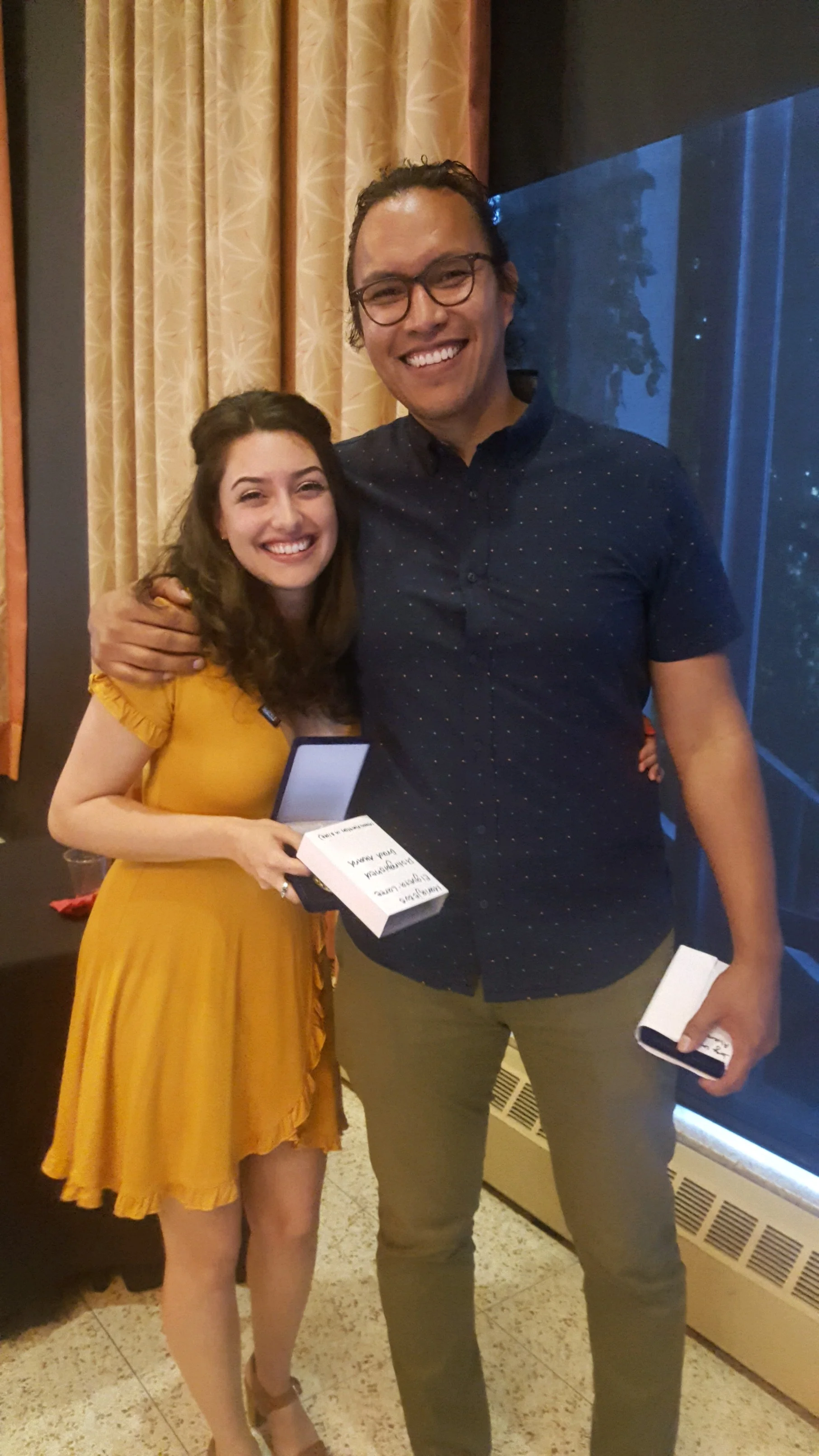 Mariajesus Elgueta and Jorge Lara Alvarado with their medallions/awards