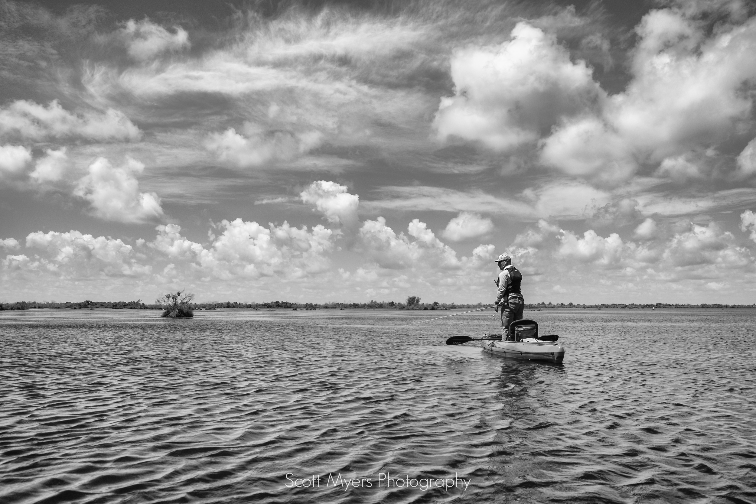 Josh Reppel keeping his eyes out for any sign of redfish.