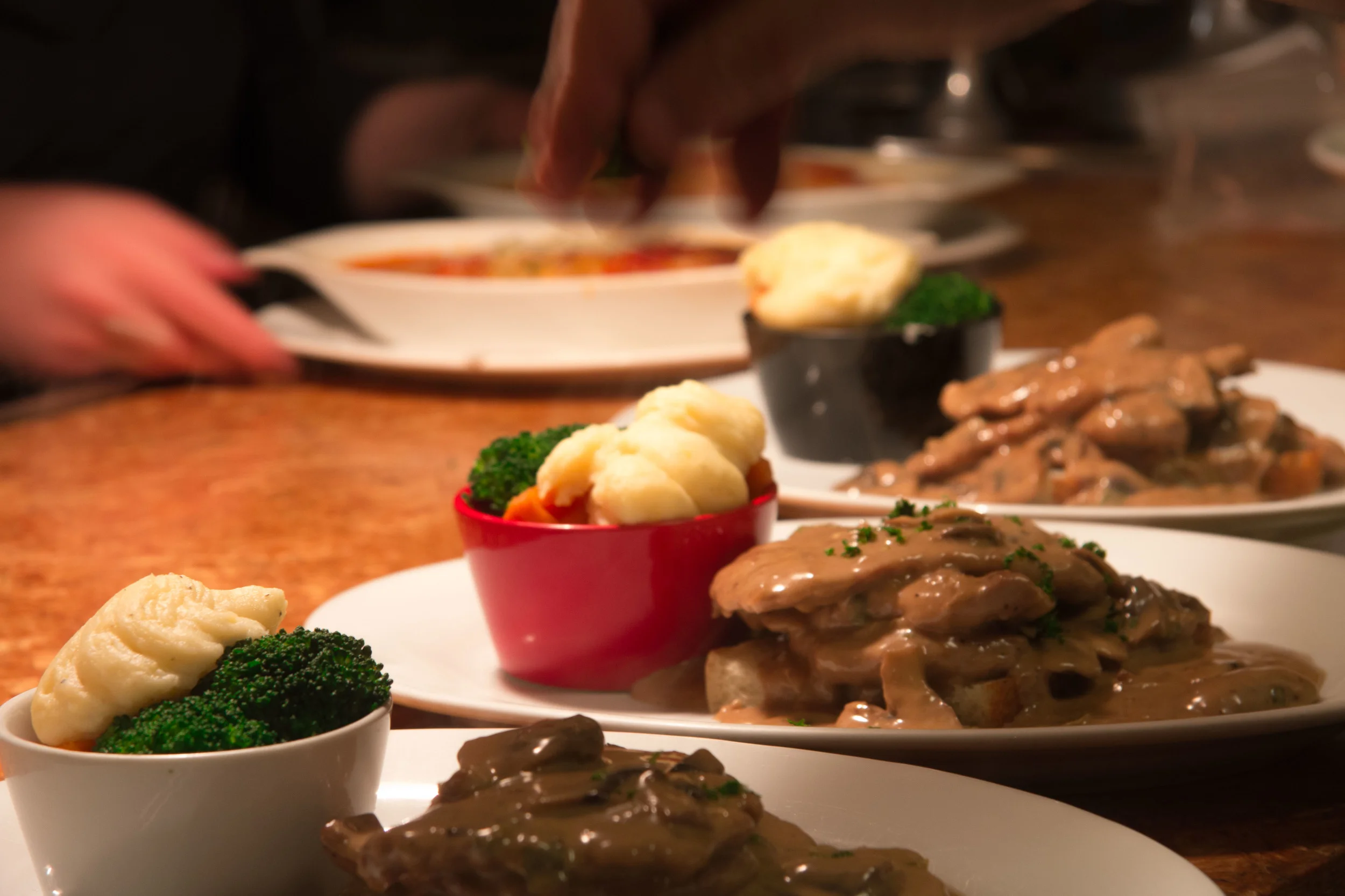 Chef making the finishing touches to our Pork Scallopine dish