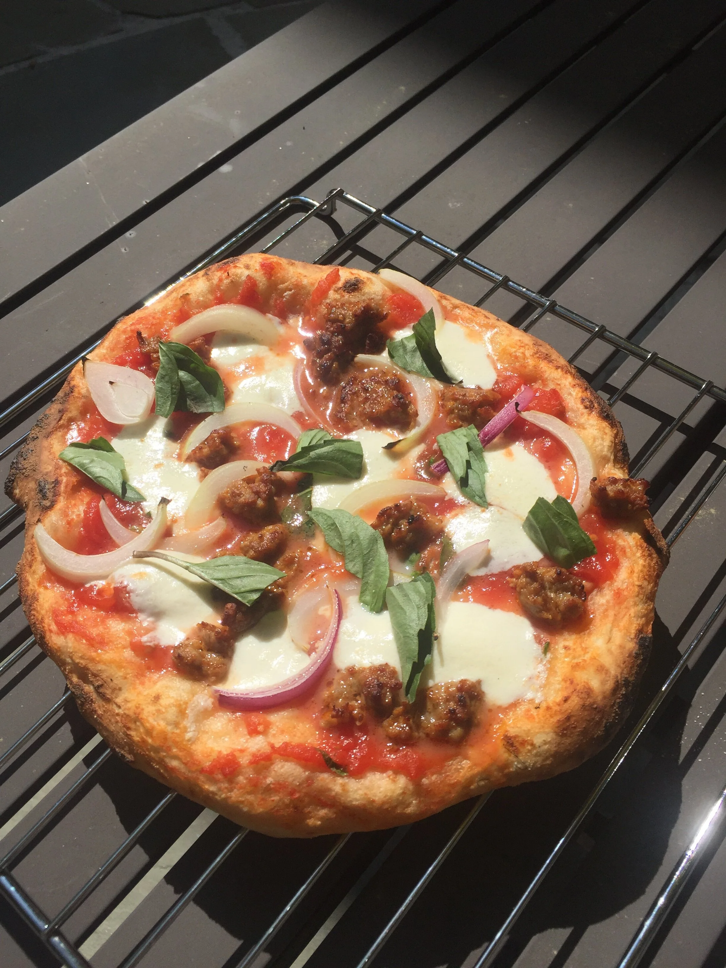 Pizza made in an Ooni pizza oven