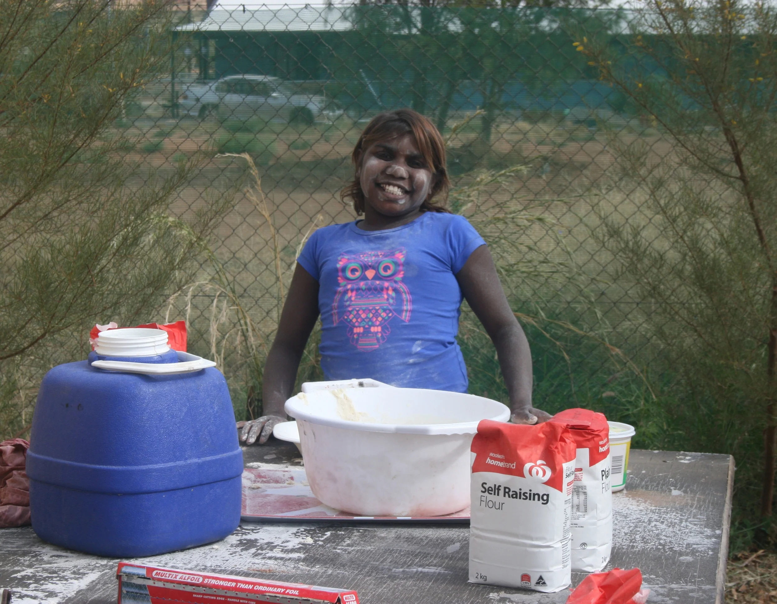 Nekita Sharpe helping to make damper at the art centre..JPG
