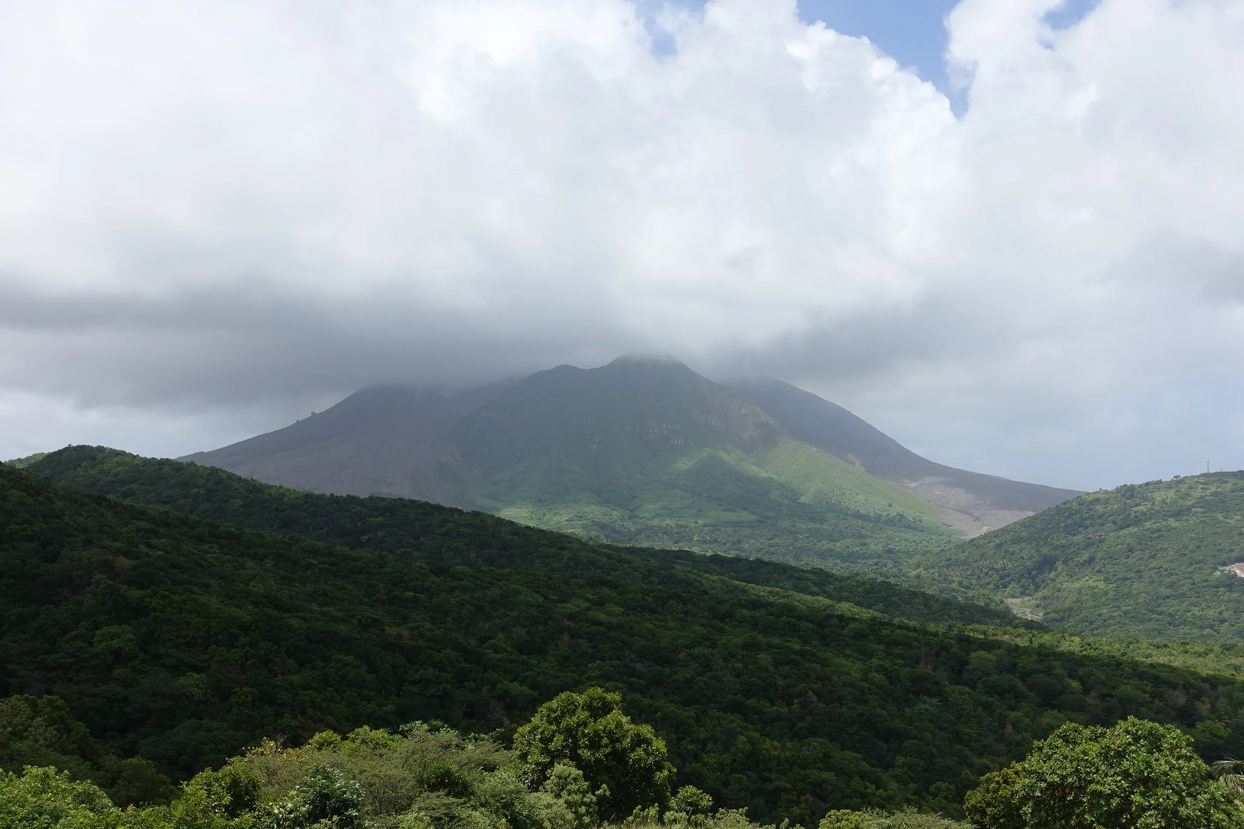 Soufriere hills volcano shrouded in clouds as seen from the Montserrat Volcano Observatory