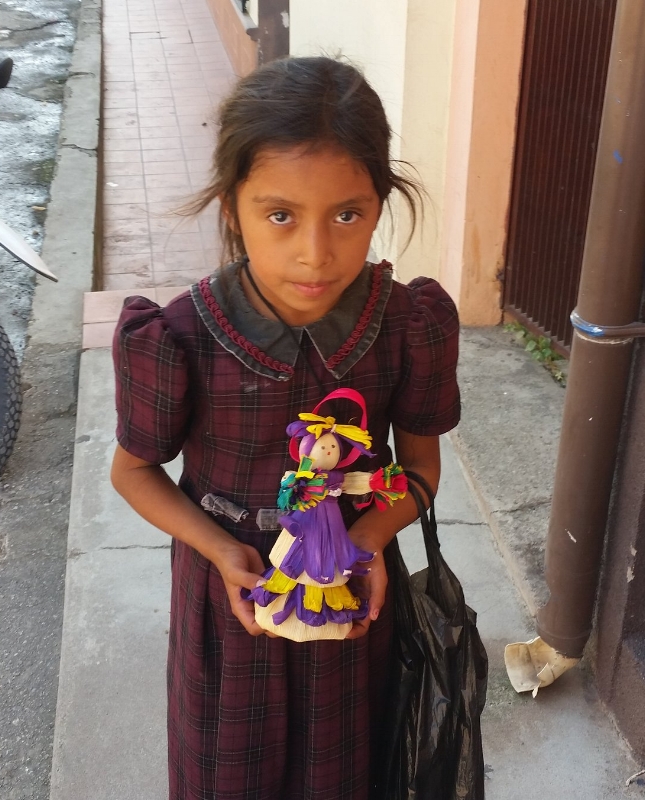 young mayan girl, copan ruinas selling Muñecas- hand made dolls