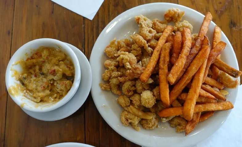 shrimp etouffee (left) and crawfish with sweet potato fries