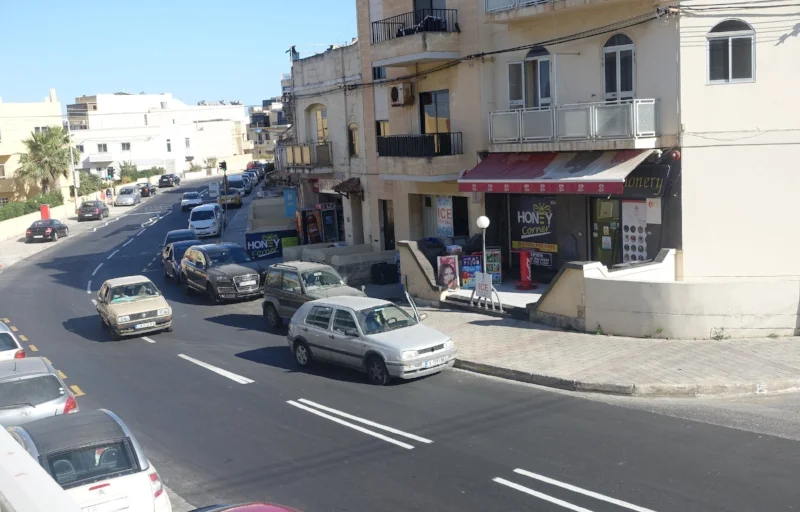 "parked" on a blind corner with the door open while doing a spot of shopping