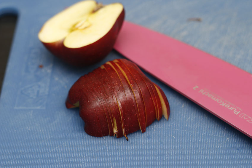 The key is to slice them nice and thin. The thinner it is, the nicer the petals are going to look and it will be easier to soften them later.