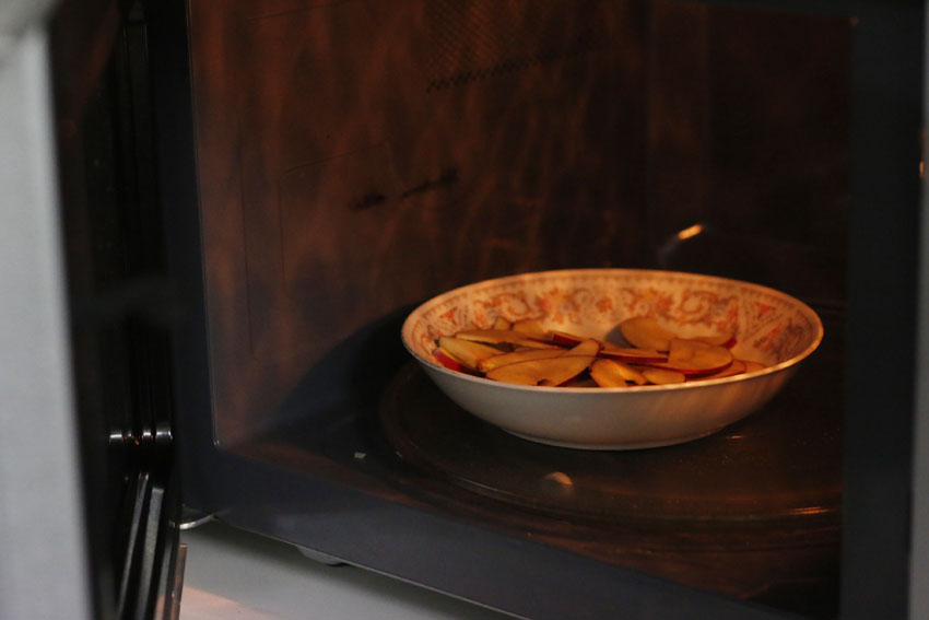 Place the apple slices into a bowl and put it in the microwave for 20-30 seconds or until soft. If you have alot of apples, you can work in batches.